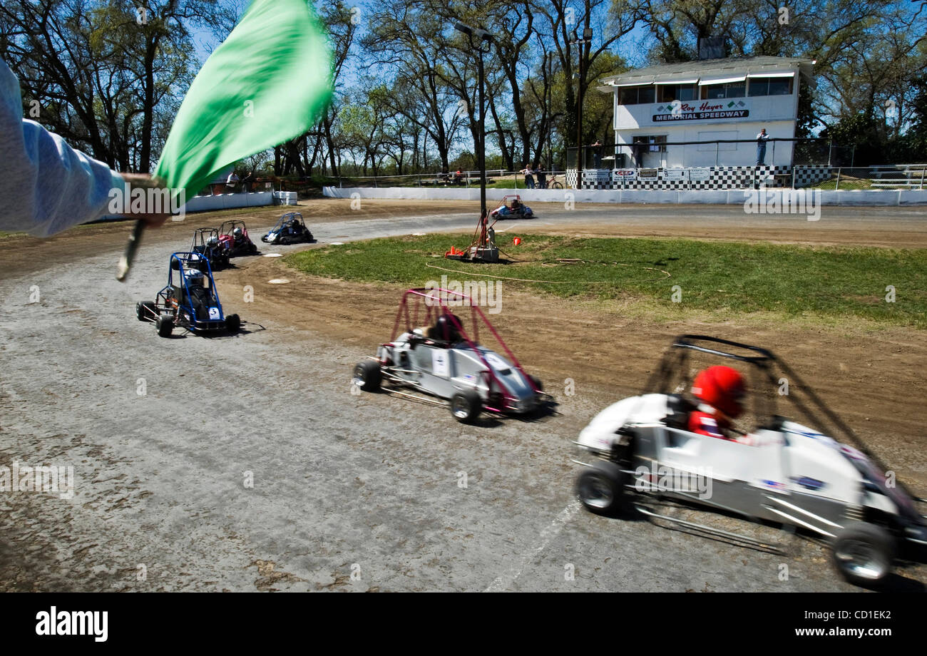 RIO LINDA, CA - MARCH 16: Flagger Denis Cochrane gives the quarter midget racers a green flag to start racing at the Roy Hayer Memoiral Speedway,  a midget race track was slated for closure by Sacramento County in Rio Linda, California on March 16, 2008. Sacramento Bee photo /  Paul Kitagaki Jr.  pk Stock Photo