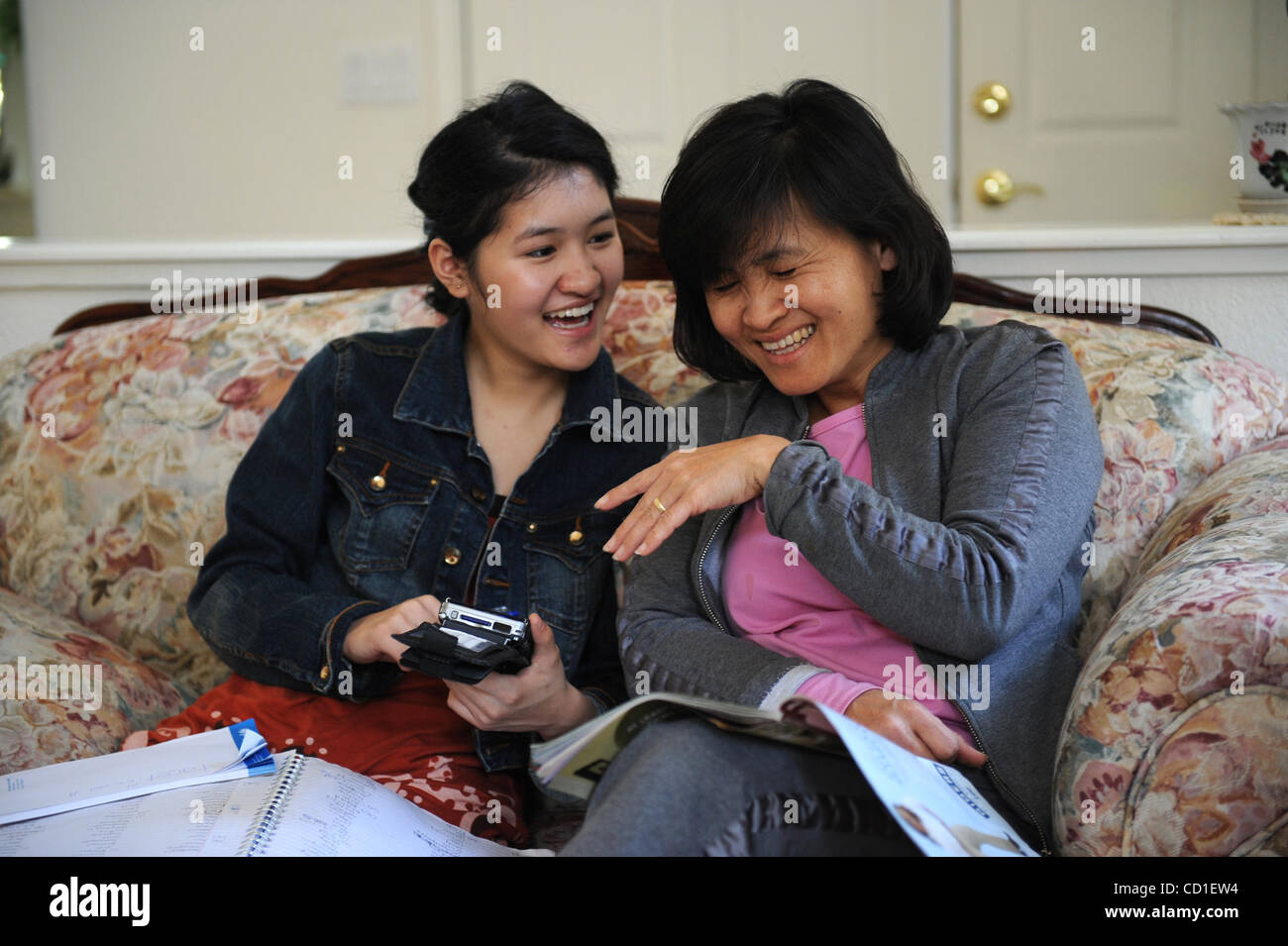 SPELLING BEE --   Josephine Kao, 12, shares some words with her mother Peggy, during a piano lesson on Tuesday, March 25, 2008 in Roseville. Kao, is a three time Regional Spelling Bee Champion that started in spelling competitions with the help of her mother, who is her main companion on her journey Stock Photo