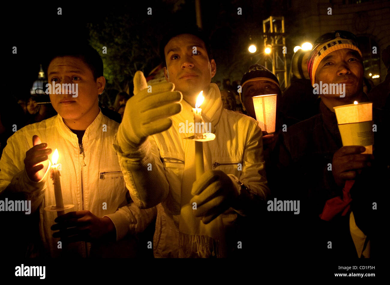 From left to right joining in the candlelight vigil are Nahum Ambros
