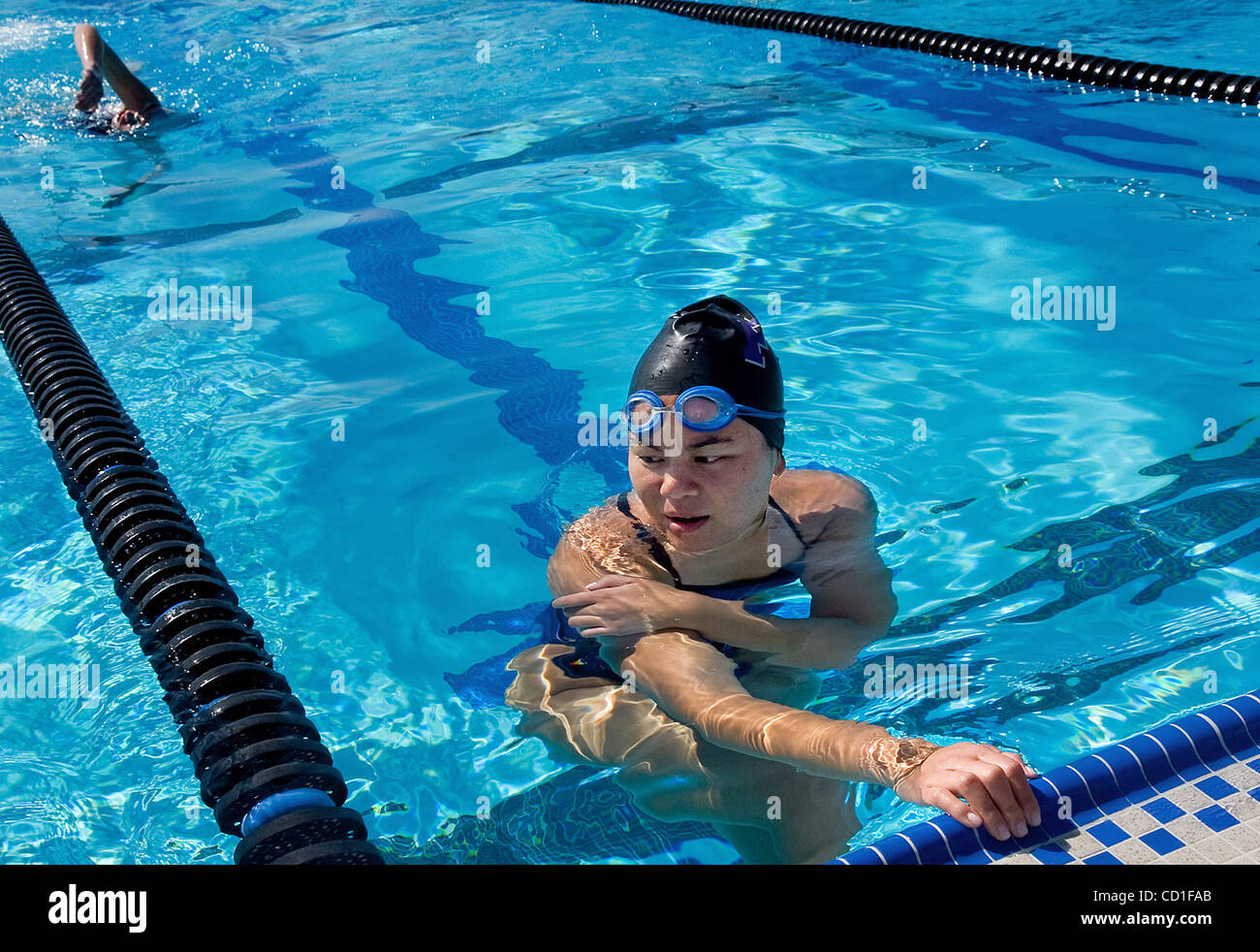 Franklin High School senior Stephanie Yu practices with her teammates at the Wackford Aquatic Center in Elk Grove on Friday Aprel 10, 2008.  It was a record year for college applications, and hence more students also received rejections or were wait-listed. Stephanie is a high achieving senior at Fr Stock Photo