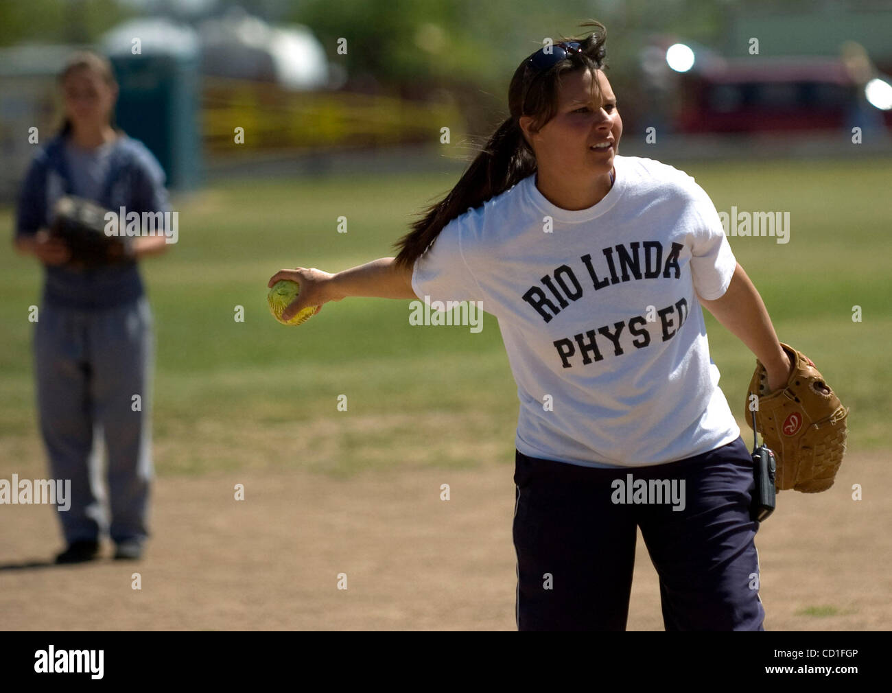 Shelia Grigsby pitches the softball to her students at Rio Linda Junior