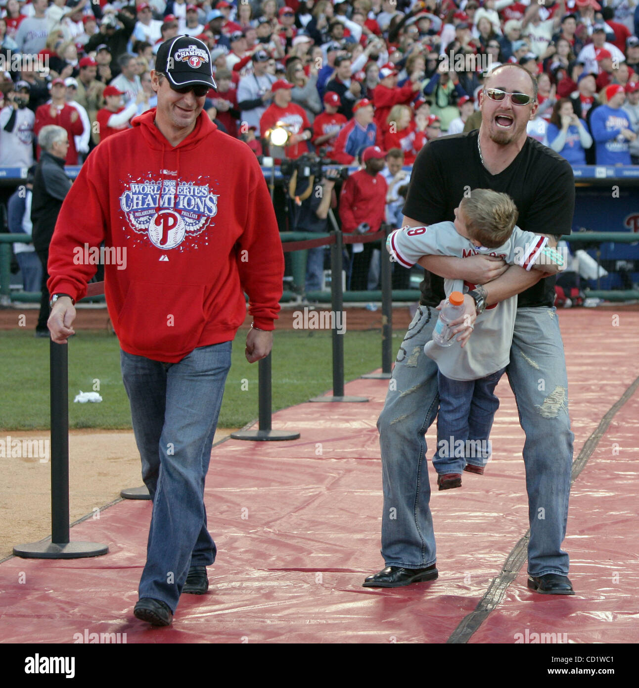 Oct 31, 2008 - Philadelphia, Pennsylvania, USA - Phillies pitcher's JAMIE  MOYER, left, watches BRETT MYERS pick-up his son Colt during the 2008 World  Series championship celebration at Citizens Bank Park. (Credit