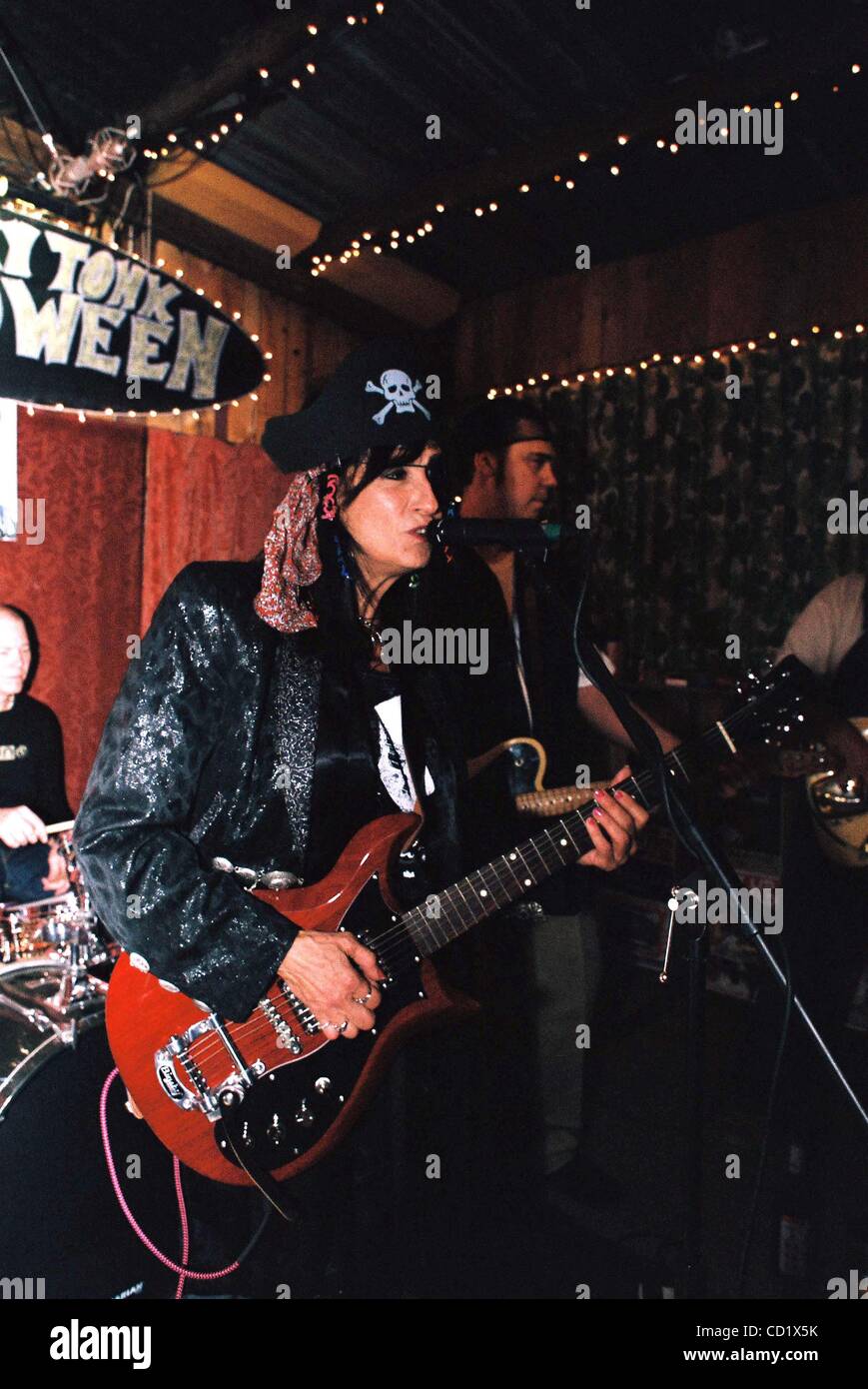 Nov. 3, 2008 - Austin,Texas, Texas, U.S. - Americana artists Rosie Flores and Jesse Dayton play a.Halloween night benefit for the Old Quarter Club in Galveston,Texas.The club received 9'' of floodwater during Hurricane Ike.The benefit show,held at Roadhouse Rags Vintage Clothing Store in Austin,Texa Stock Photo