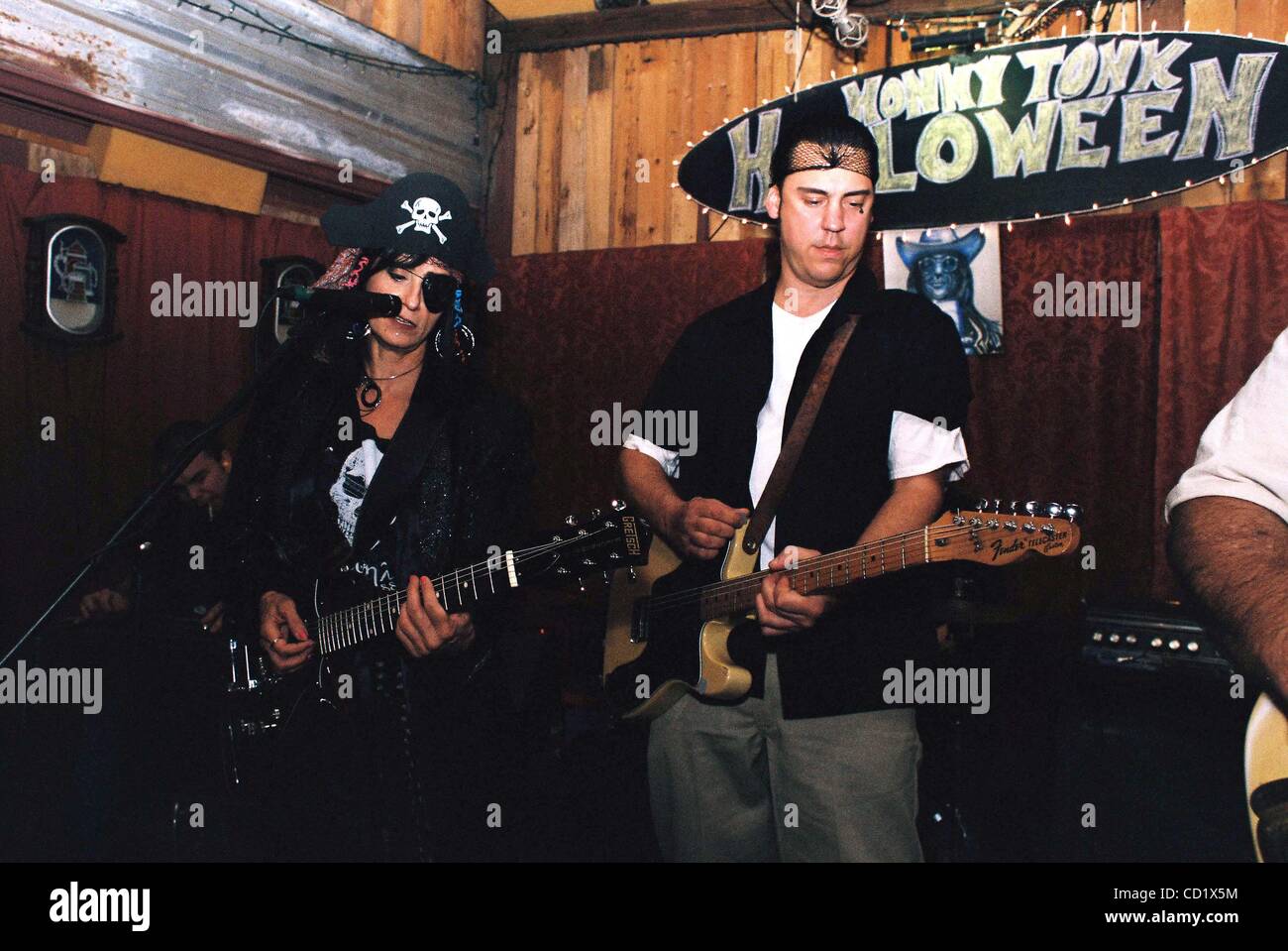 Nov. 3, 2008 - Austin,Texas, Texas, U.S. - Americana artists Rosie Flores and Jesse Dayton play a.Halloween night benefit for the Old Quarter Club in Galveston,Texas.The club received 9'' of floodwater during Hurricane Ike.The benefit show,held at Roadhouse Rags Vintage Clothing Store in Austin,Texa Stock Photo