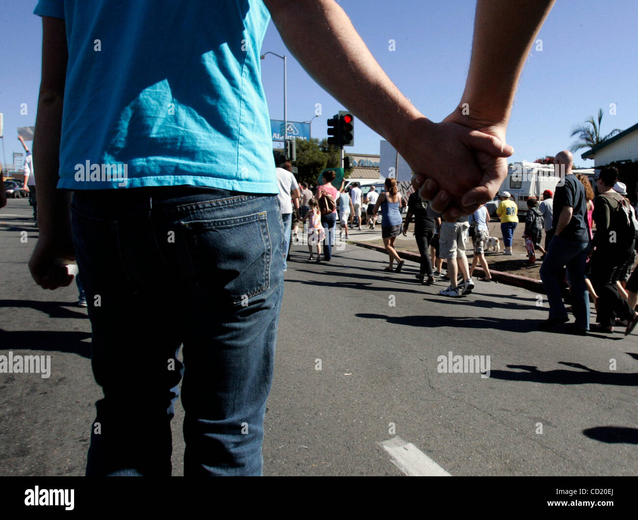 November 8, 2008 ALEX HEMPTON, left, holds hands with his partner DAN SULLIVAN, right, during a protest march on Saturday. Thousands of people turned out to protest the recently passed Prop 8 (ban on gay marriage) and marched nearly two miles (down University Avenue from Hillcrest to North Park), at Stock Photo