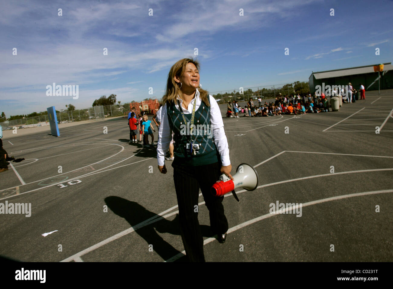 November 13, 2008 San Diego Principal ROSEMARY CRUZ smiles with relief at the conclusion of the  Great Southern California ShakeOut' at Cubberly Elementary in Serra Mesa, on Thursday morning. The 'shakeout' was billed as the largest earthquake drill in U.S. history, as  an estimated 5.1 million peop Stock Photo