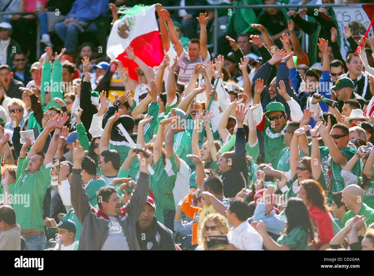 Mexican fans take part in 'the wave' during the friendly game between the pre-Olympic national teams of Mexico and Australia at McAfee Coliseum in Oakland, Calif., on Sunday, Mar. 2, 2008. Mexico and Australia tied 1-1.  (Ray Chavez/The Oakland Tribune) Stock Photo