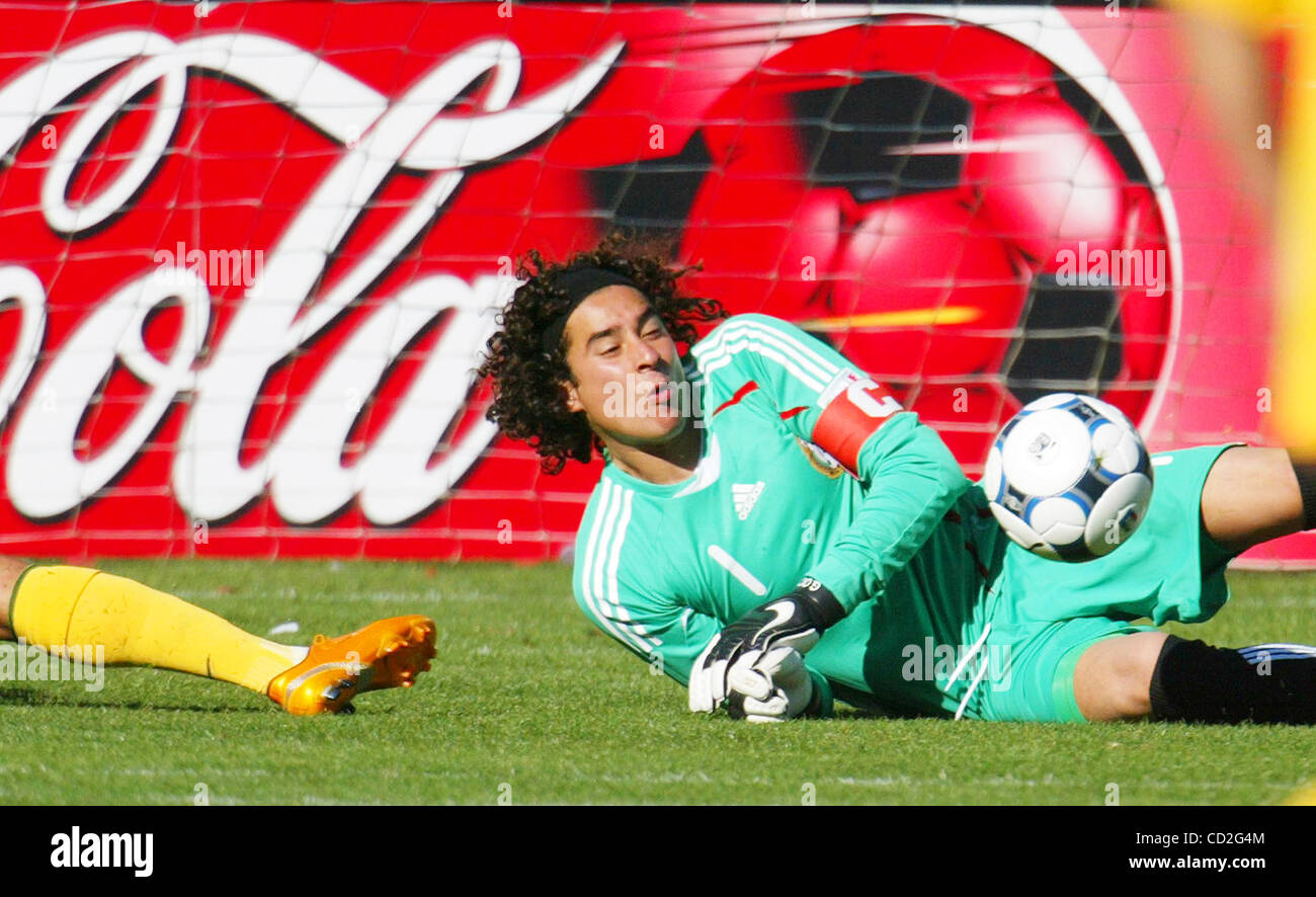 Mexico's goalie Guillermo Ochoa stops a shot to Australia's David  Williams during the second half of their friendly game at McAfee Coliseum in Oakland, Calif., on Sunday, Mar. 2, 2008. The pre-Olympic teams tied 1-1. (Ray Chavez/The Oakland Tribune) Stock Photo