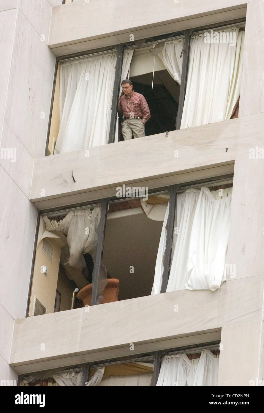 A guest at the Omni Hotel at the CNN Center peers out the shattered window of his guest room after an apparent tornado ripped through the downtown district in Atlanta, Georgia, on Saturday, March 15, 2008. State officials have put the damage estimates at least $150 million.(Credit Image: © Erik Less Stock Photo
