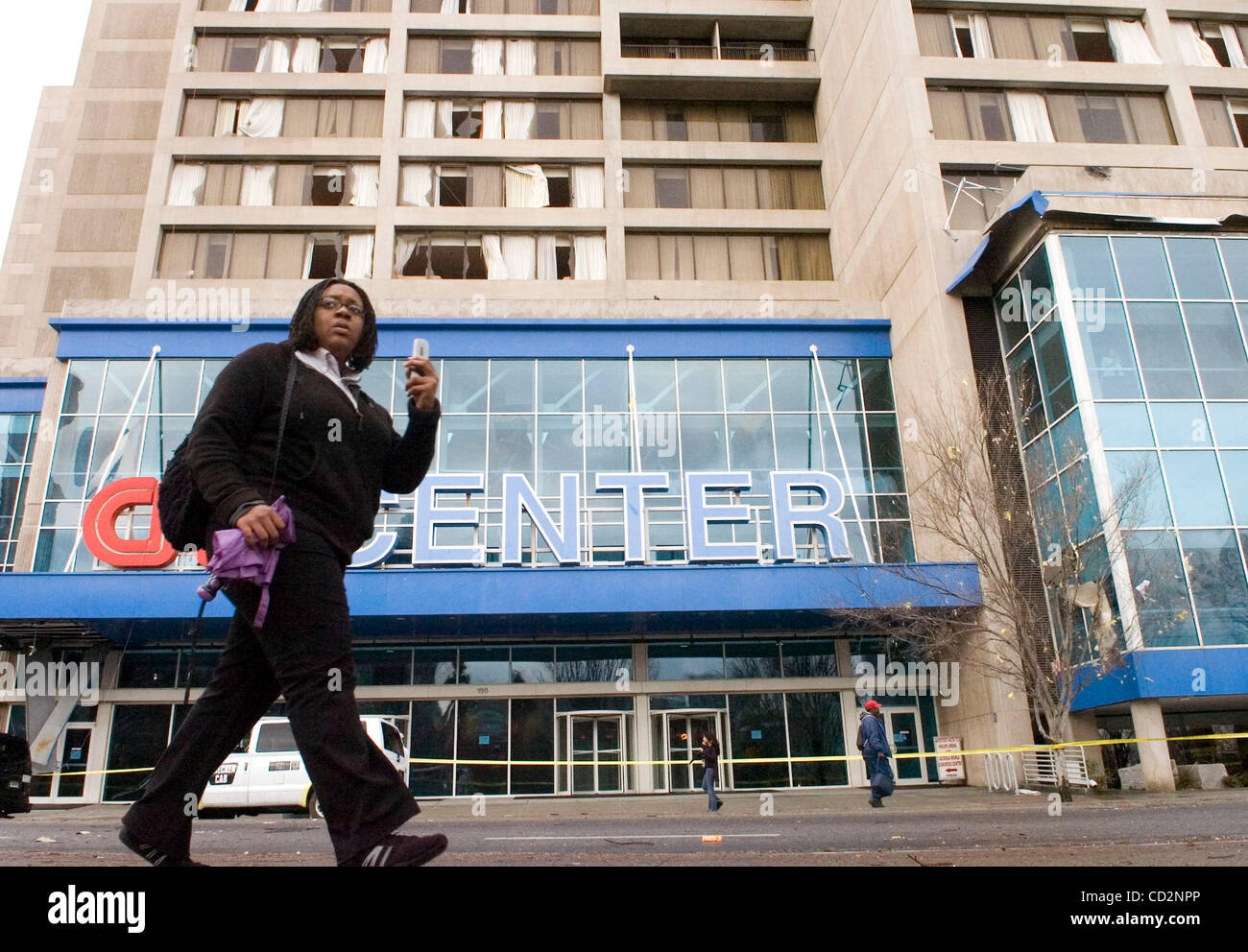 A Woman Walks Past The Damaged Cnn Center After An Apparent