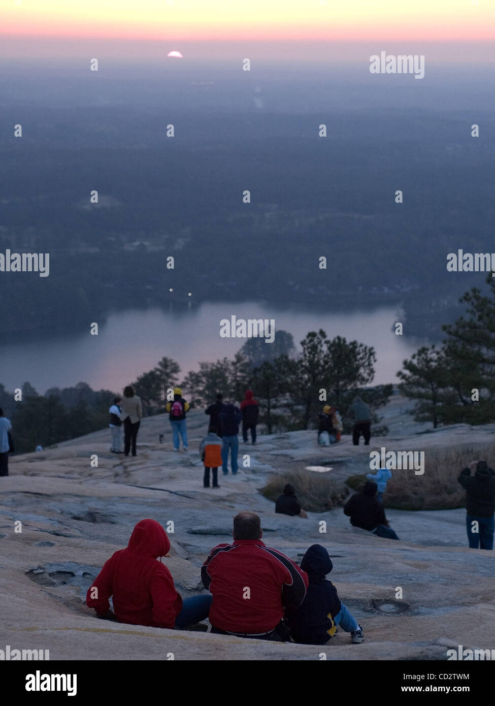 Worshipers watch as the sun rises during the Easter Sunrise Service on the top of Stone Mountain, Ga. The world's largest piece of exposed granite, Stone Mountain rises 1,863-feet above sea level