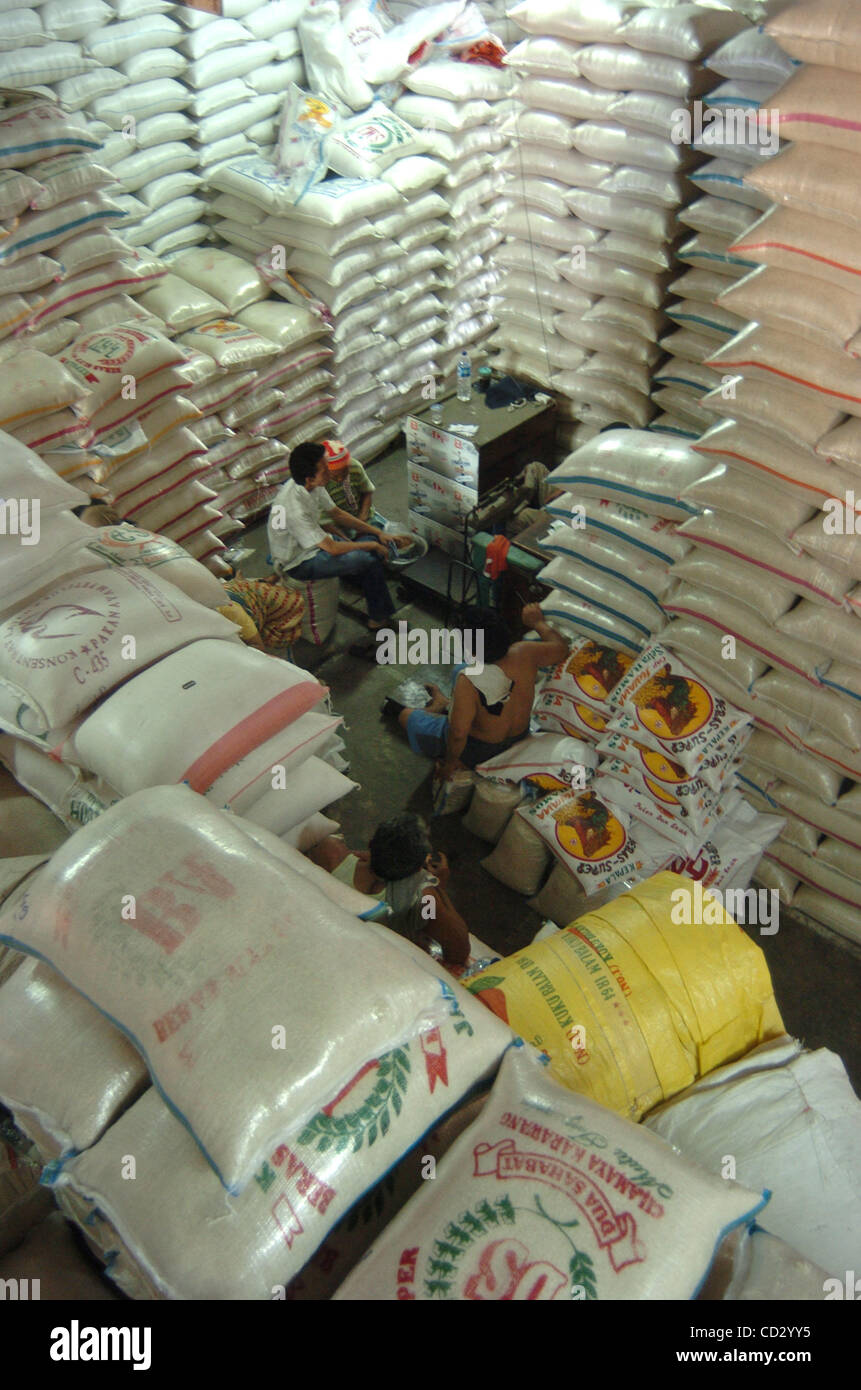 A rice seller prepares rice sack for sale in Jakarta,Indonesia, March ...