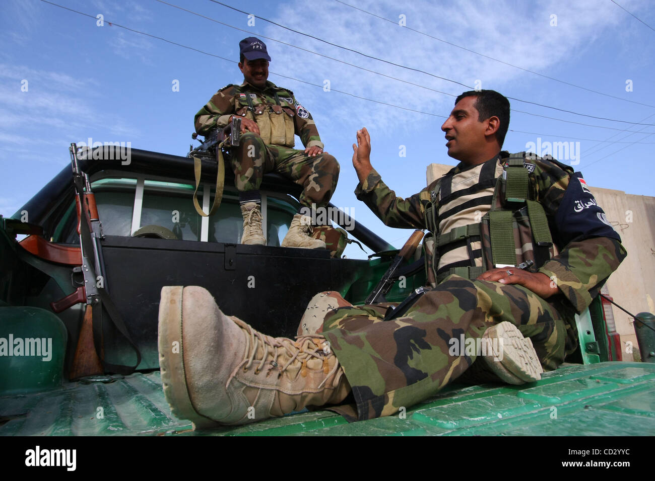 Mar 29, 2008 - Baqubah, Diyala, Iraq - Members of the Iraqi Police sit on the back of a pickup at a Police post in Baqubah, waiting to get out on a patrol.  (Credit Image: © Simon Klingert/ZUMA Press) RESTRICTIONS: * Germany Rights OUT * Stock Photo