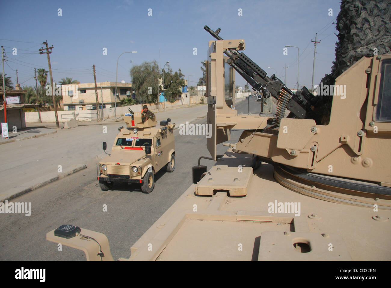 Apr 04, 2008 - Tahrir, Baqubah, Iraq - An Iraqi Security Forces vehicle passes a  MRAP (Mine- Resistant- Ambush- Protected) vehicle manned by soldiers of Charly  Battery, 2nd Battalion 12th Field Artillery Regiment as part of 4th Brigade,  2nd Infantry Division patroling the streets of Baqubah, Iraq Stock Photo