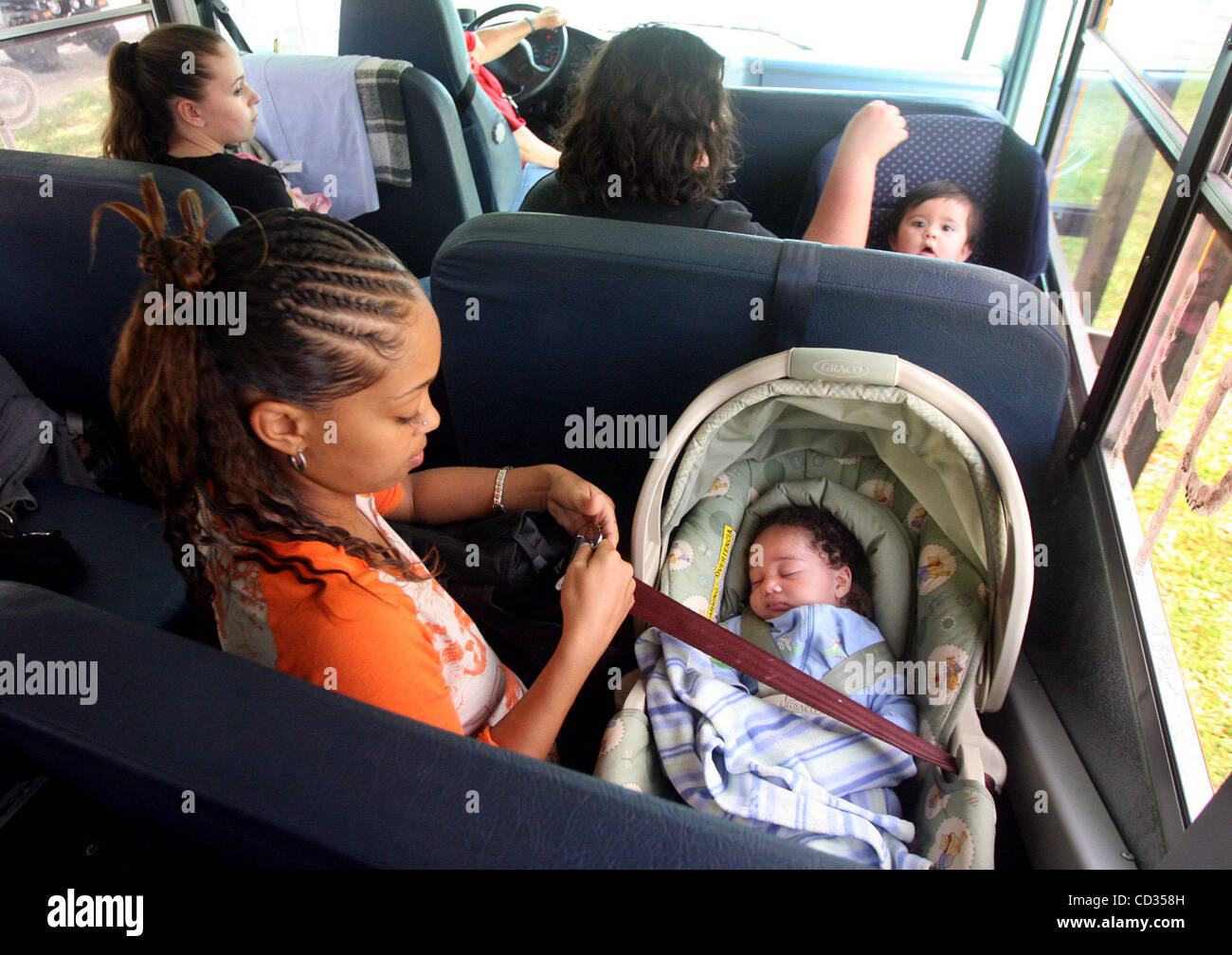 CLEARWATER Wednesday (4/9/2008)  Teen mother Tia Ketter (CQ), 17, of Tarpon Springs, left, buckles her two-month-old son Jerome Joe (CQ, Ketter) into a school bus Wednesday after attending a dropout prevention program at the YWCA's adolescent pregnancy and parenting service's north county office in  Stock Photo