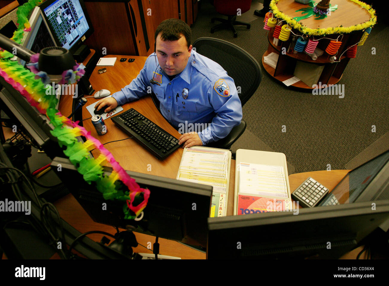 040108 tc met dispatch (1 of 4)--0051737A--Staff Photos by Amanda Voisard/The Palm Beach Post----for tc met story by   Jill Taylor- Stuart-   Martin County Fire Rescue Dispatcher, Branden Hamilton, cq, responds to a call at the Martin County Sheriff's office, Wednesday. 04/09/08 NOT FOR DISTRIBUTIO Stock Photo