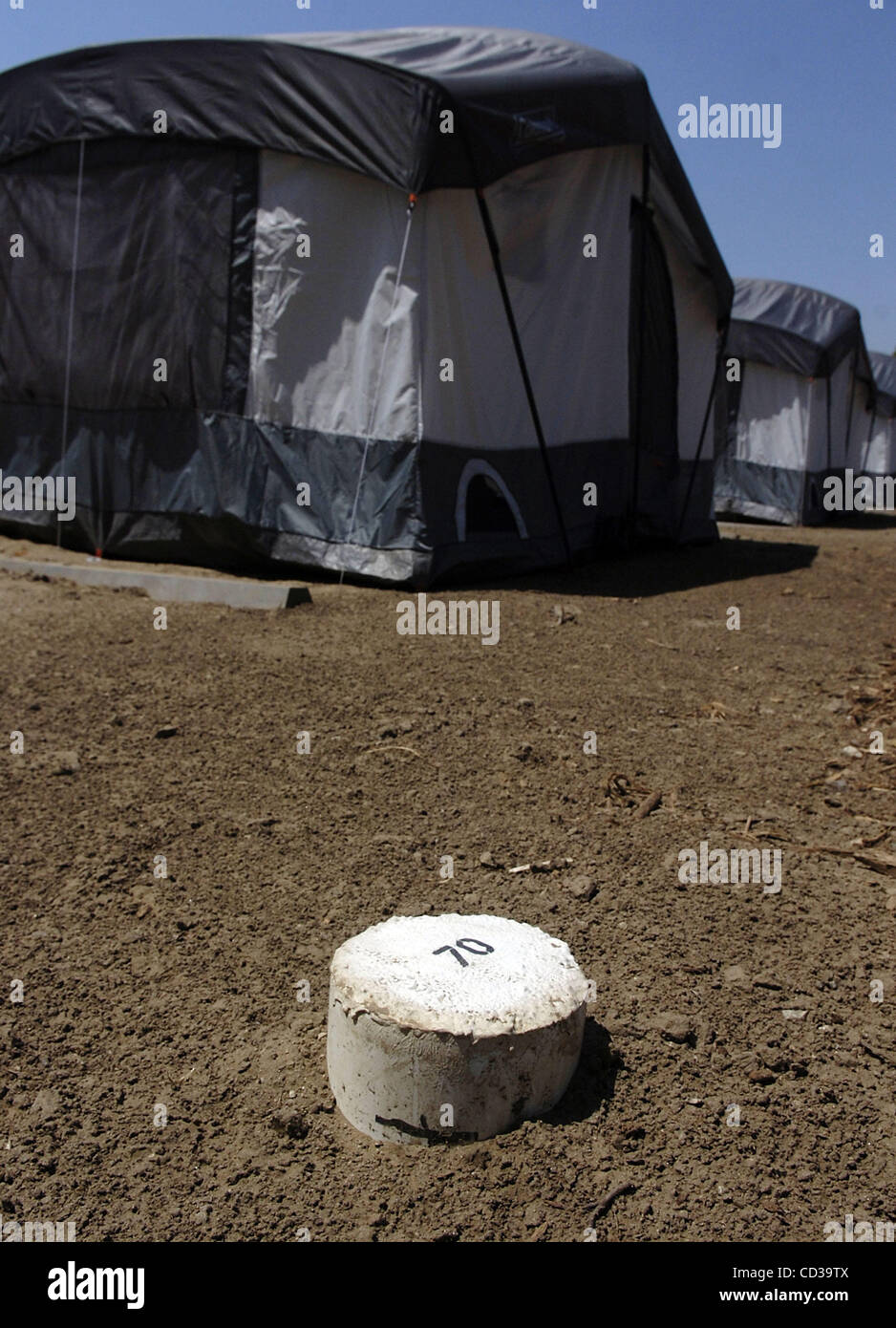 A concrete marker shows one of the 140 tent sites within the Tent City