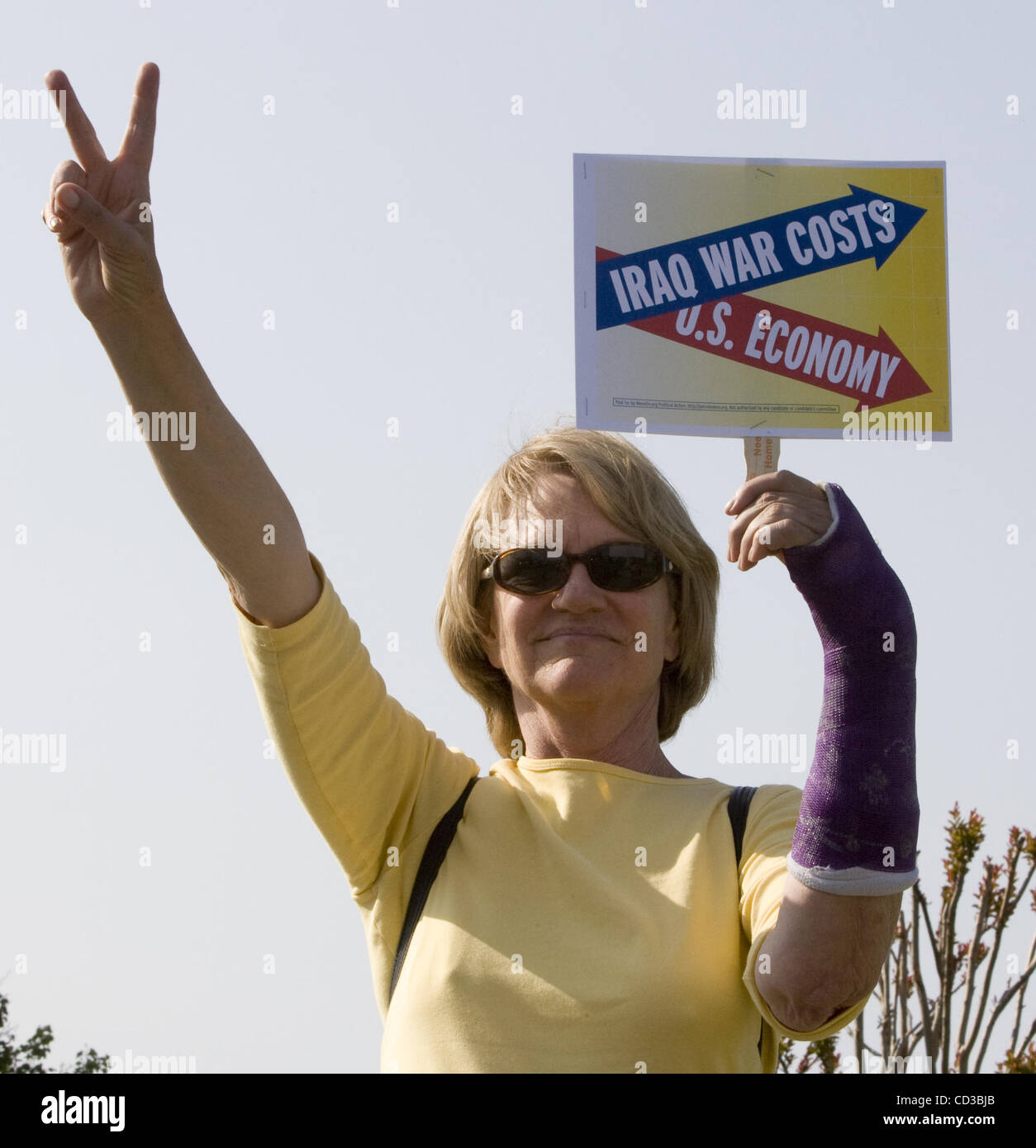 Ellen Gardner, showing the peace sign, came out to protest the war in