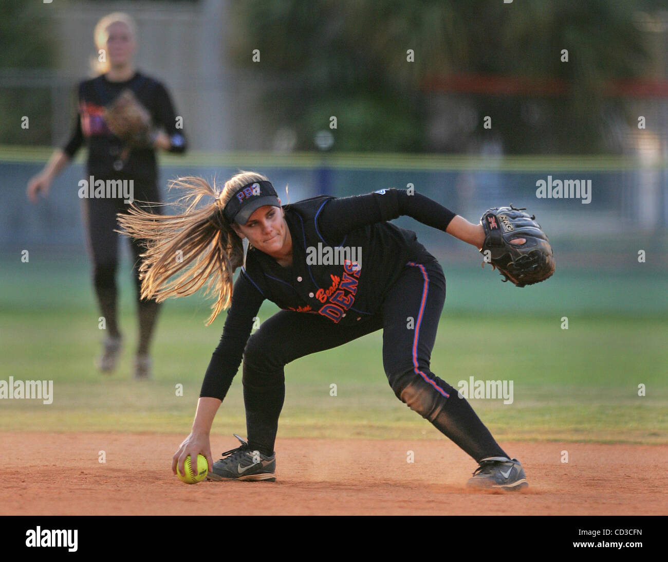 042508 spt district track--0052066A-- staff photo by Allen Eyestone/The Palm Beach Post -- Palm Beach Gardens, FL..  Park Vista at Palm Beach Gardens softball...Palm Beach Gardens second baseman #1 Haley Fleming bobbles a ball hit by Park Vista's #39 Marissa Thomas . Thomas was safe at first base. Stock Photo