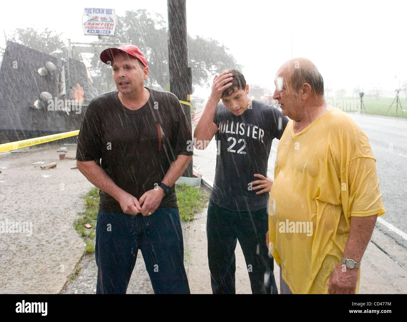 Tate Lefort Sr. (L), his son Tate Jr. (C) and his father Logan react