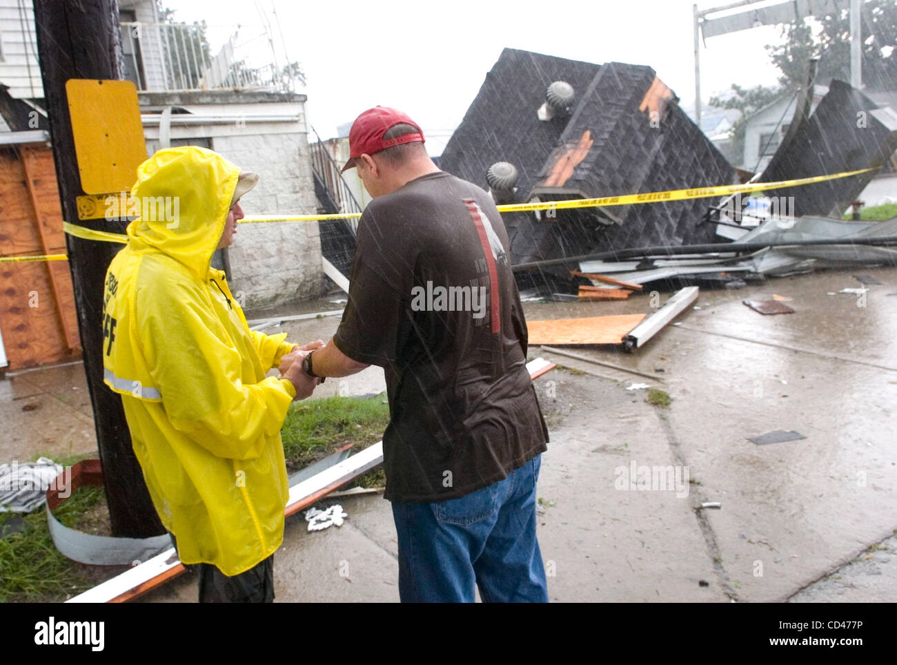 Tate Lefort Sr., (R) prays with Rev. John Matherne after Lefort's