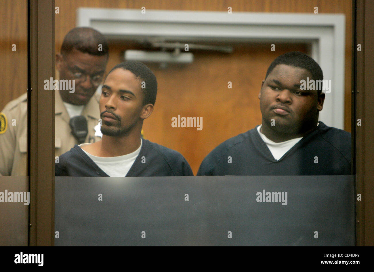 October 2, 2008, Vista, CA, USA PATRICK JONES, left, and DYWANE TOUSANT (cq) listen from behind glass during their arraignment in Vista Superior Court. They and two others are being charged in the abduction of a teenage girl Credit: photo by Charlie Neuman, San Diego Union-Tribune/Zuma Press. copyri Stock Photo