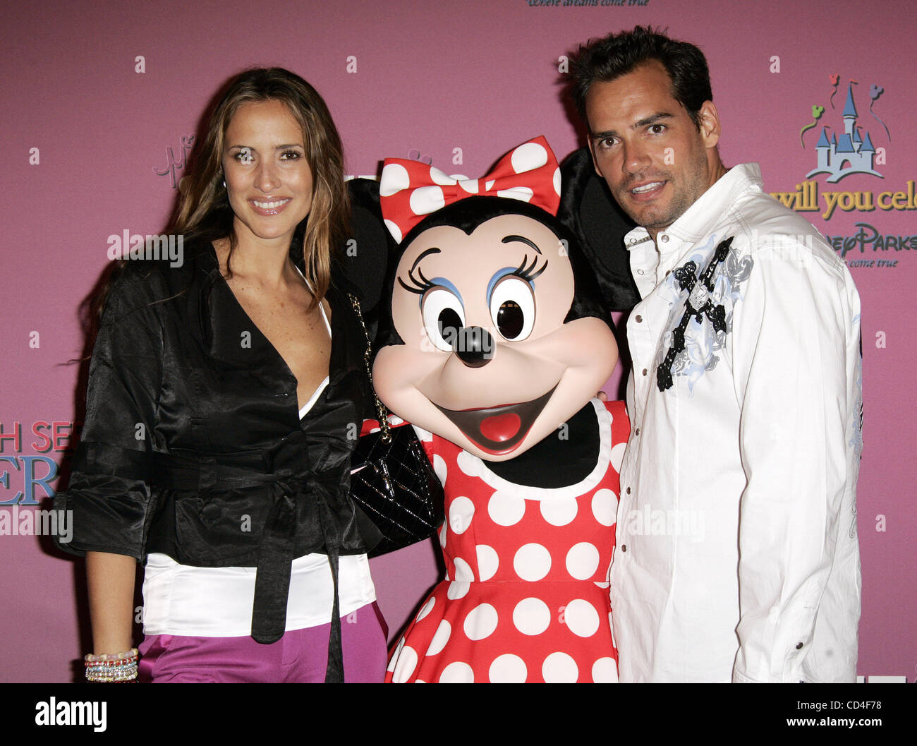 Oct 05, 2008 - Anaheim, California, USA - Chilean model and actor CRISTIAN DE LA FUENTE and guest with MINNIE MOUSE at the Miley Cyrus Sweet 16 Birthday Party held at Disneyland in Anaheim. (Credit Image: © Lisa O'Connor/ZUMA Press) Stock Photo
