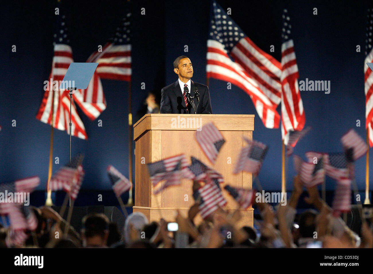 Newly elected President of the United States, Barack Obama looks over a ...