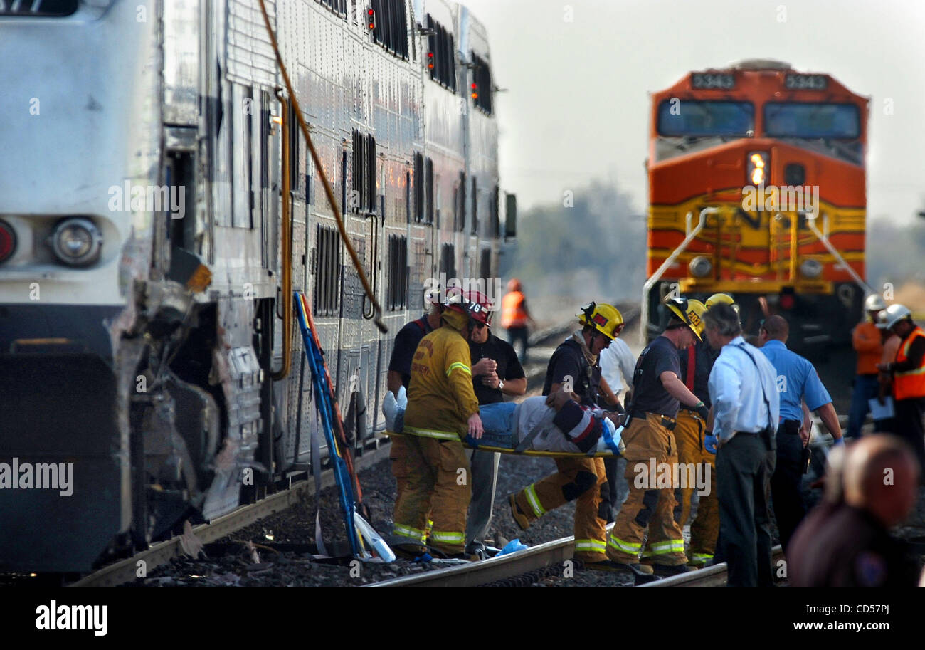 November 20, 2008 Rialto, California USA Firefighters remove a