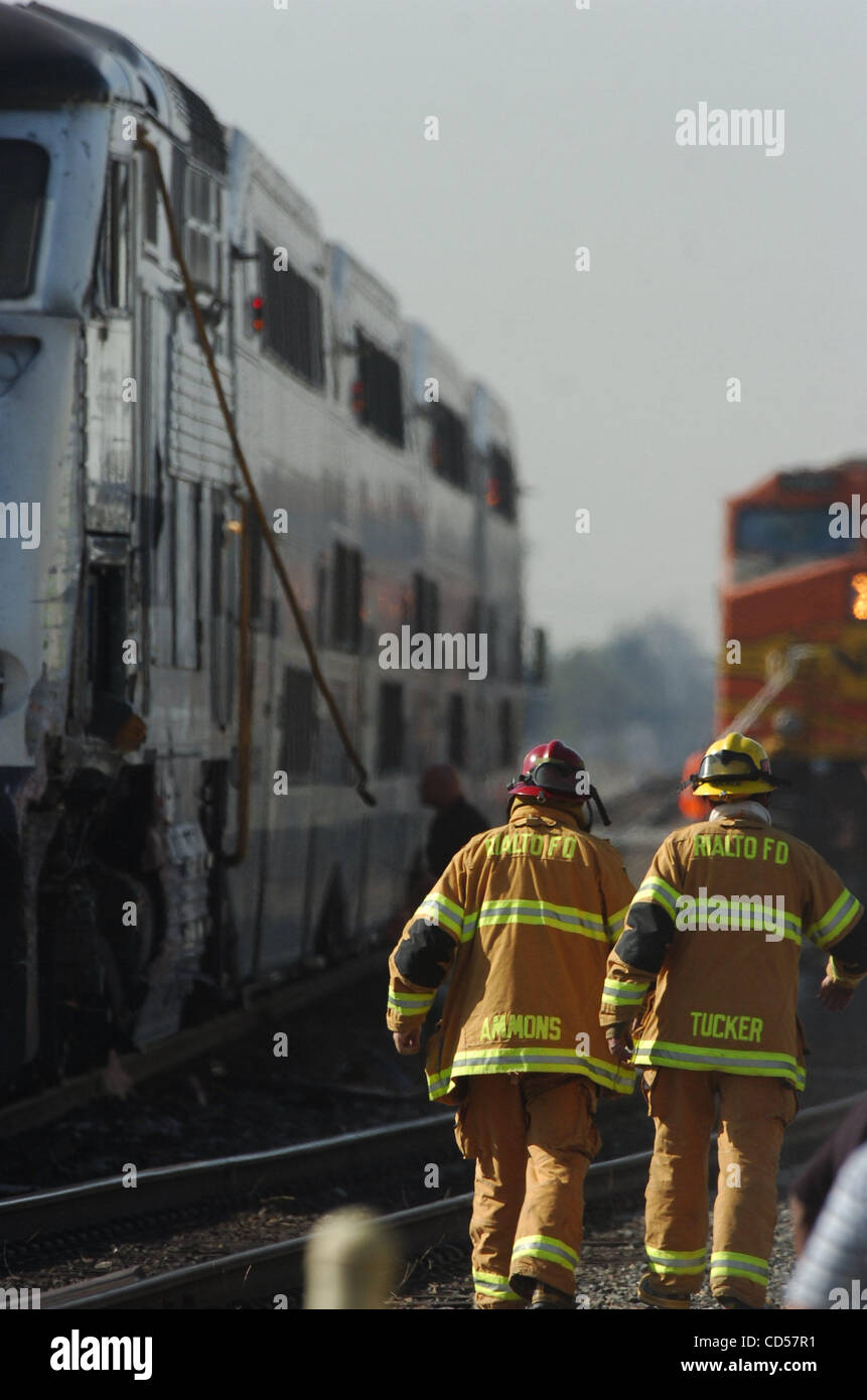 November 20, 2008 Rialto, California USA Firefighters remove a