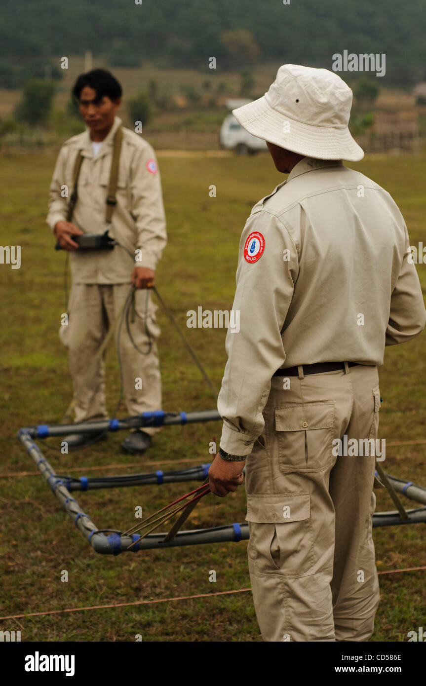 UXO Laos bomb disposal personnel using an Ebinger UPEX 740M metal