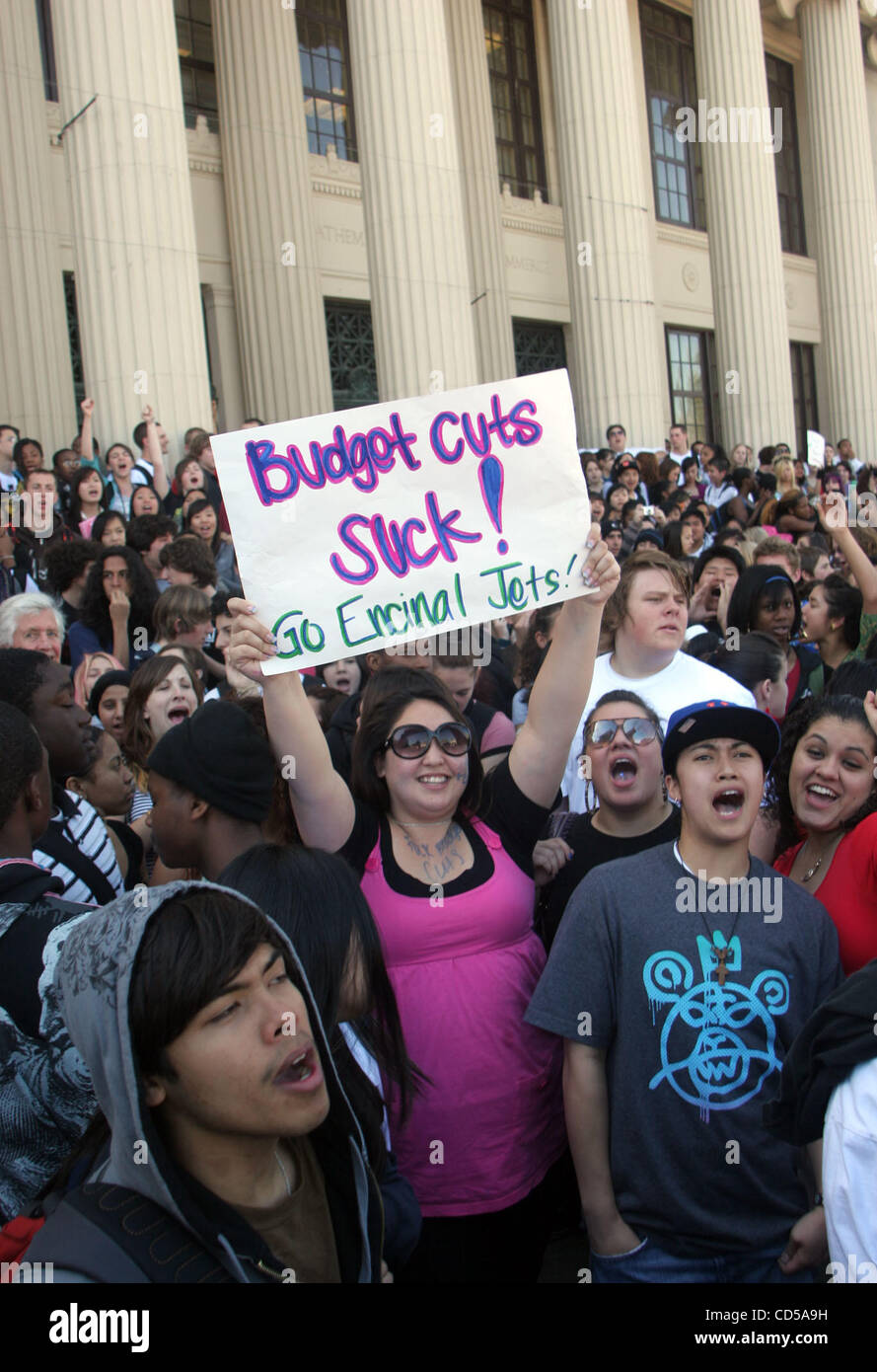 Hundreds of students protest proposed cuts in athletics and music