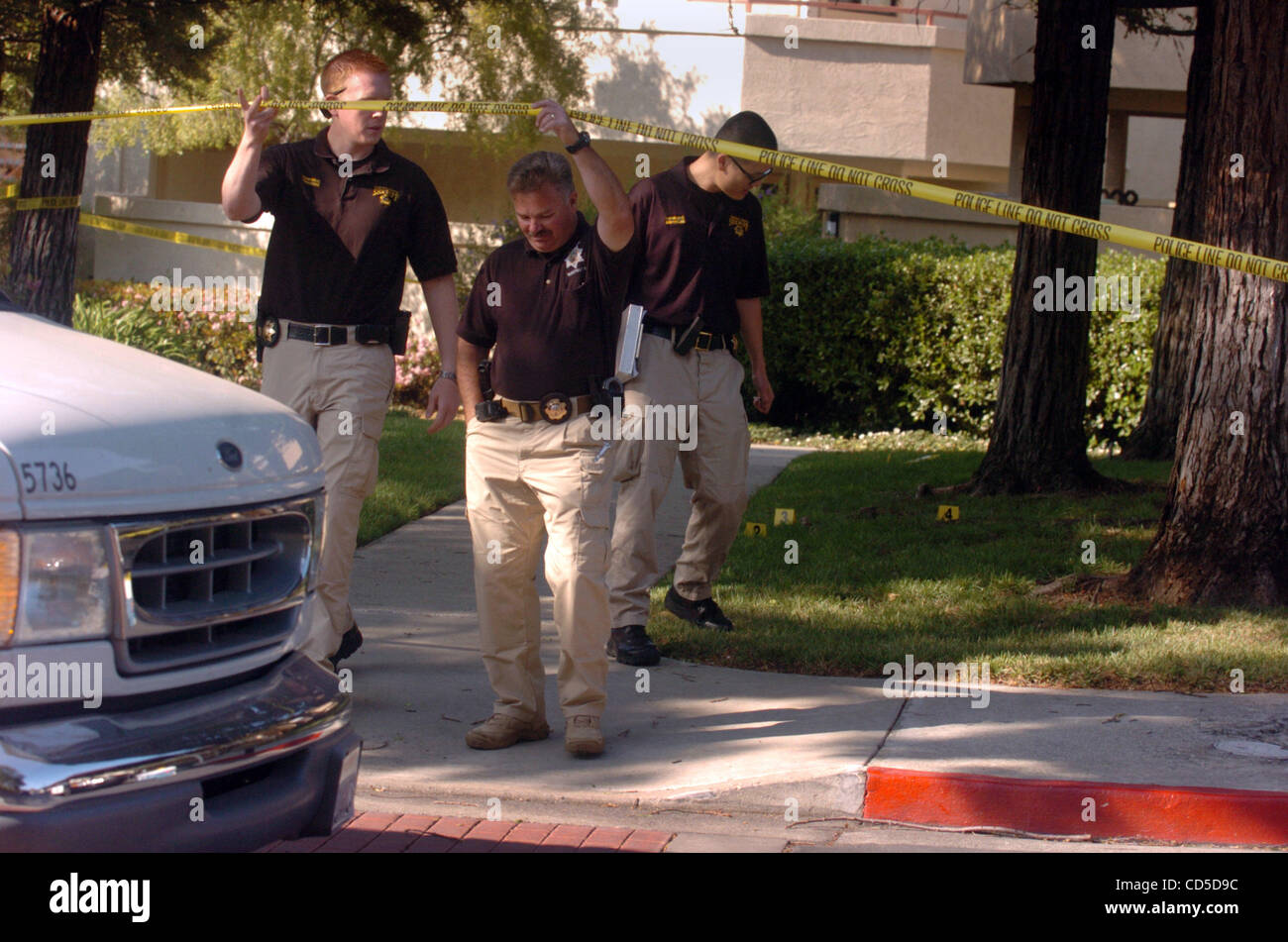 Concord Police Crime Scene Investigator Craig Oelrich, center, holds up