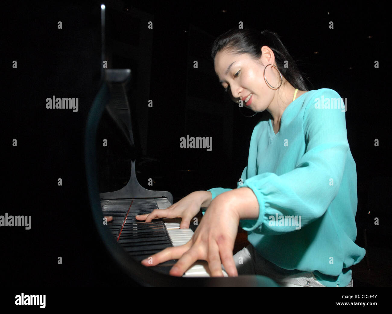 Keyboardist Eun Jung Jin rehearses at Los Medanos College in Pittsburg ...