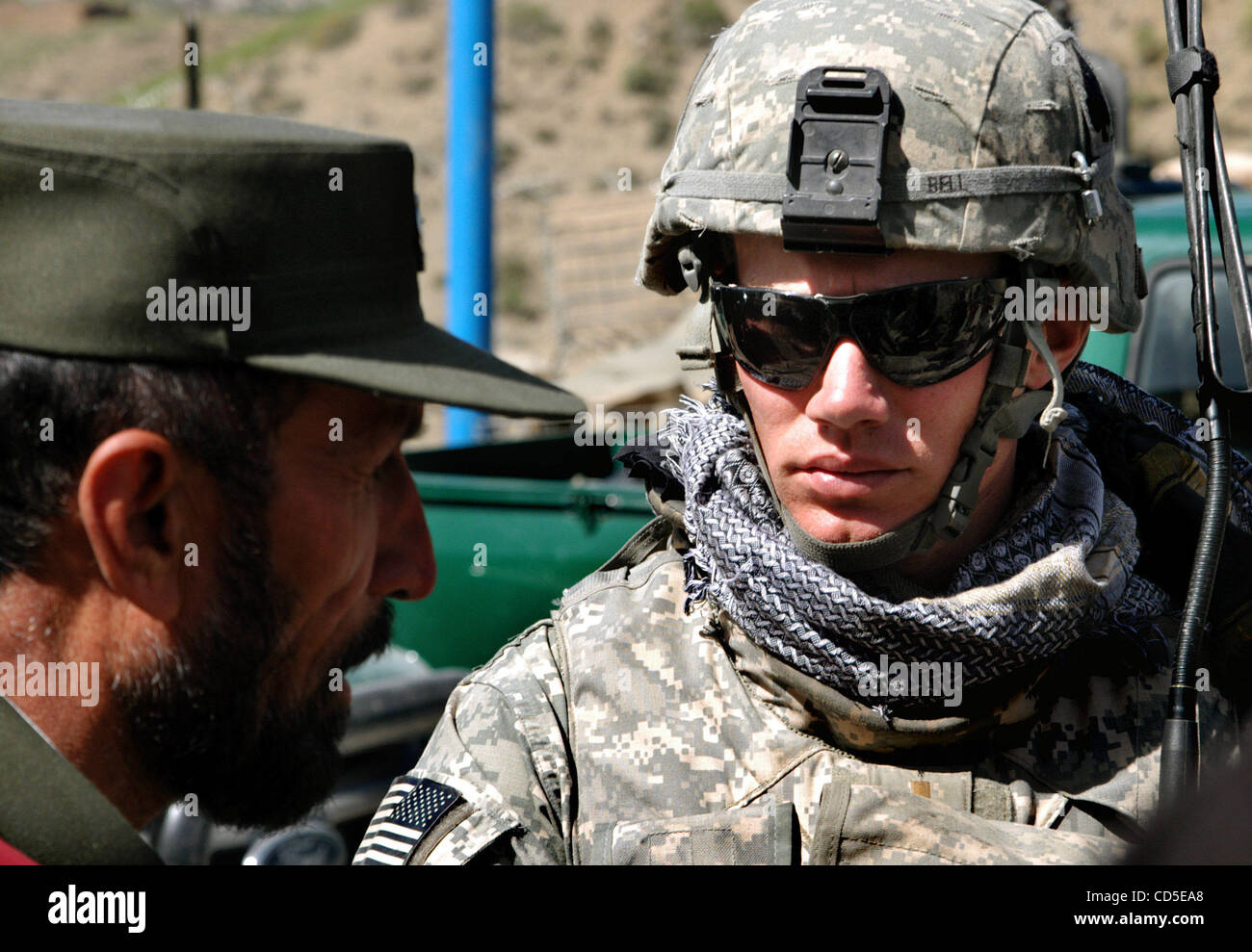 Apr 29, 2008 - Paktya Province, Afghanistan - LIEUTENANT KEVIN BELL of the 1-61 Cavalry, 4th Brigade Combat Team, 101st Airborne, discusses security concerns with the new district Afghan National Civil Order Police (ANCOP) commander on patrol in eastern Afghanistan. Bell, a 2006 graduate of Davidson Stock Photo