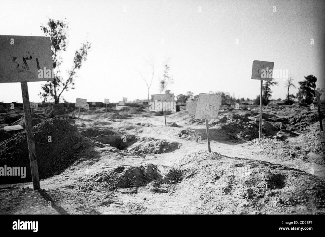 Jun 24, 2003 - Al-Musayab, Iraq - Inside the graveyard at Abu Ghraib, Iraq, next to the prison, a walled-off plot held the remains of prisoners who were executed during the fighting. Most of the graves are exhumed.  (Credit Image: © David I. Gross/ZUMAPRESS.com) Stock Photo