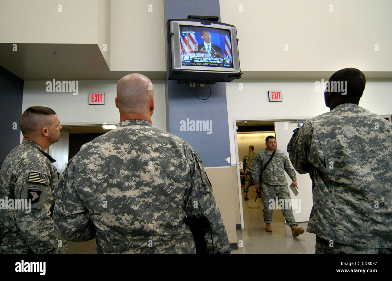 Mar 18, 2008 - Fort Campbell, Kentucky, USA - In the air head terminal at Fort Campbell, Ky, awaiting transportation for their fifteen-month deployment to Afghanistan in support of Operation Enduring Freedom, soldiers watch Barack Obama's speech explaining his relationship with his controversial Chi Stock Photo