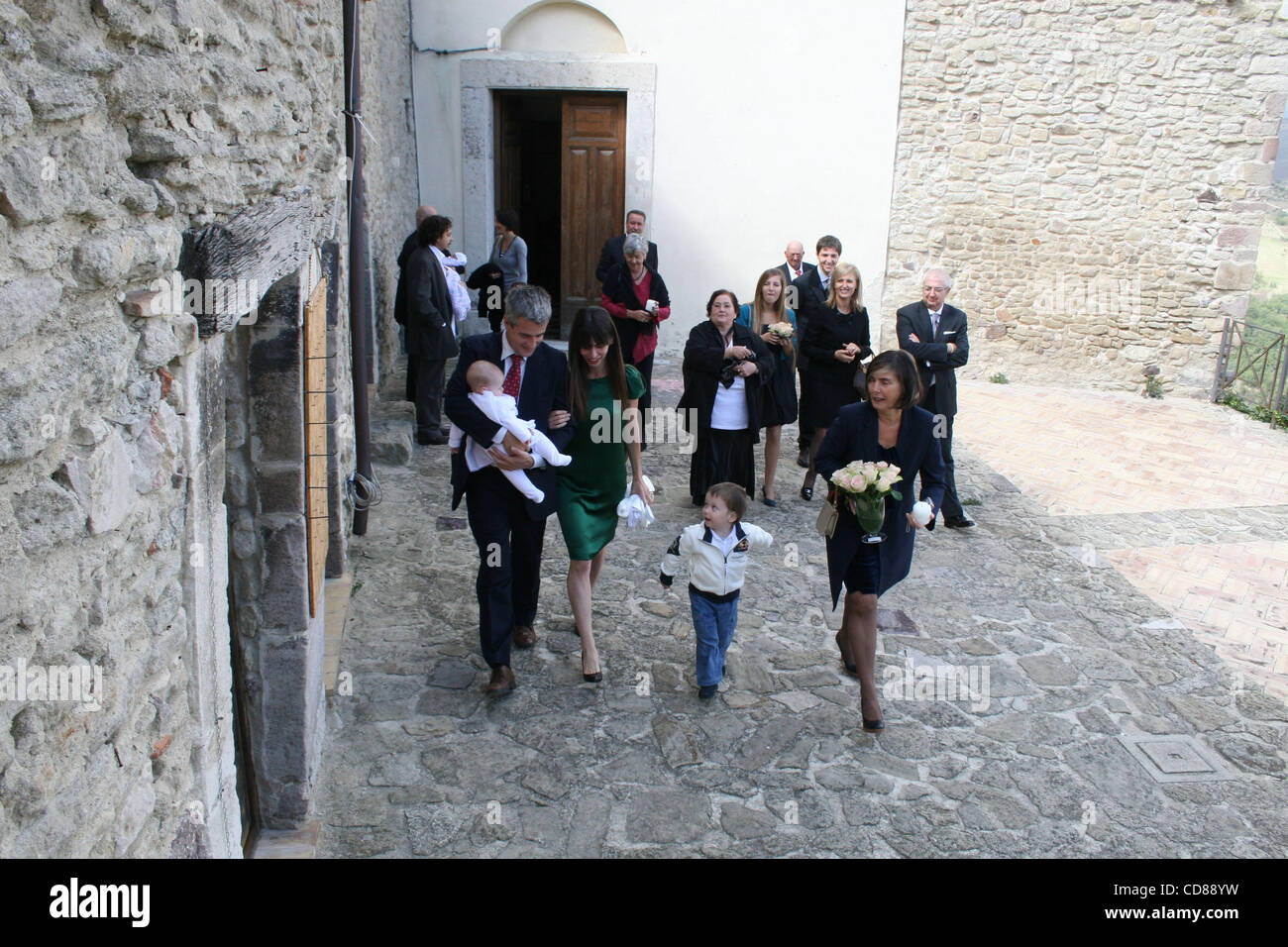 Oct 04, 2008 - Roccascalegna, Chieti, Italy - Actor DERMOT MULRONEY with new Italian partner THARITA CESARONI and baby MABEL RAY coming out of the church after the Baptism. Far right EMY CASERONI, Tharita's mother. (Credit Image: © Luciano Borsari/ZUMA Press) Stock Photo