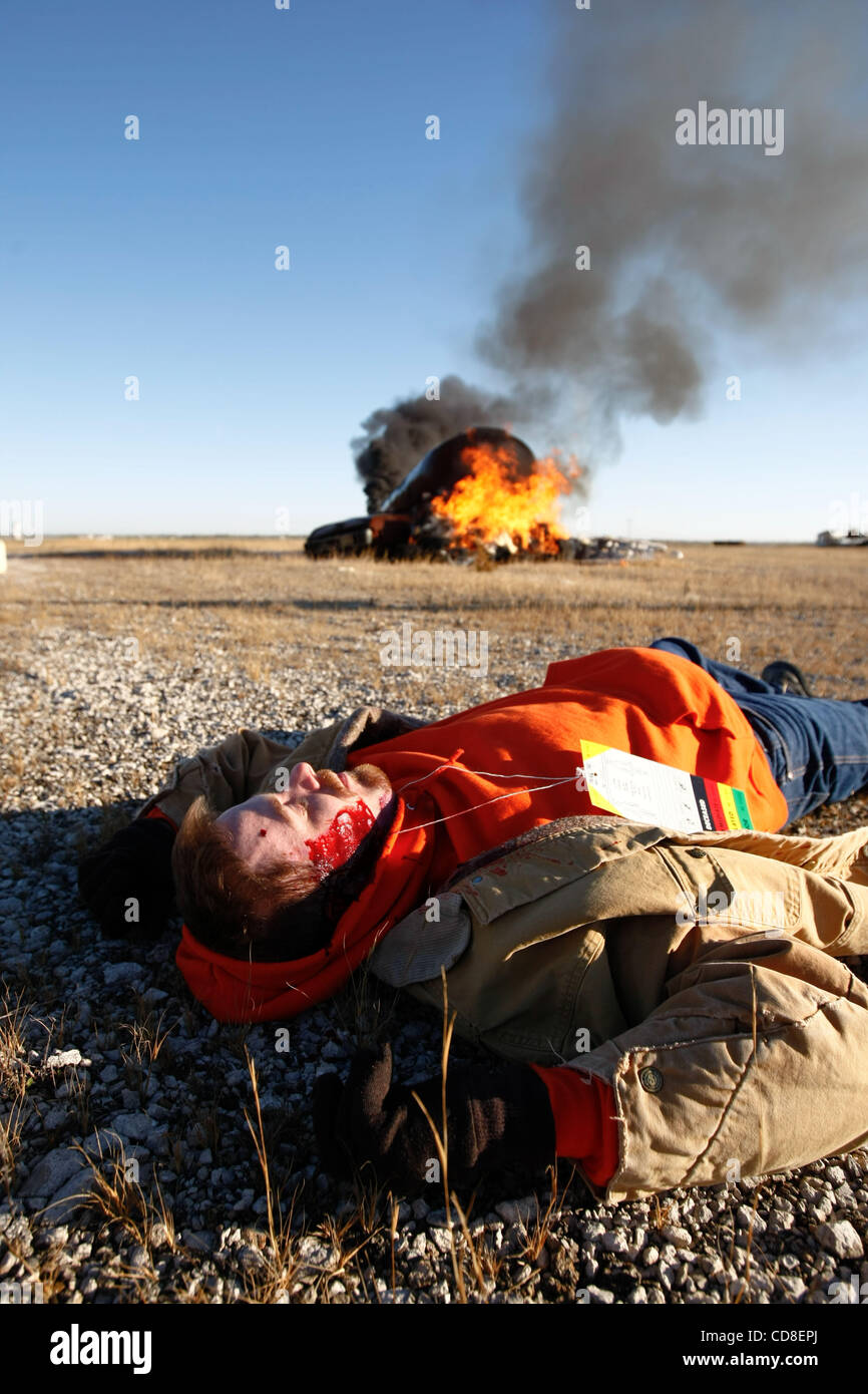 Oct 28, 2008 - Topeka, Kansas, USA - A participant acts as a victim of a plane crash during a disaster drill at Forbes Field in Topeka, Kansas. Several Shawnee and Douglas county emergency agencies conducted the disaster exercise at Forbes Field to train with Department of Homeland Security purchase Stock Photo