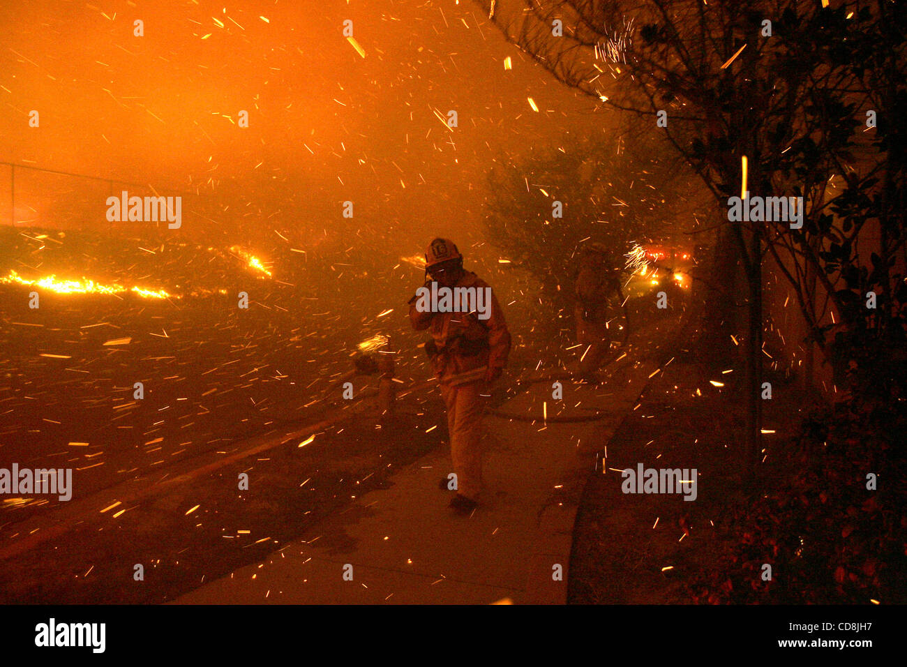 Nov 15, 2008 - Los Angeles, California, USA - A firefighter walks ...
