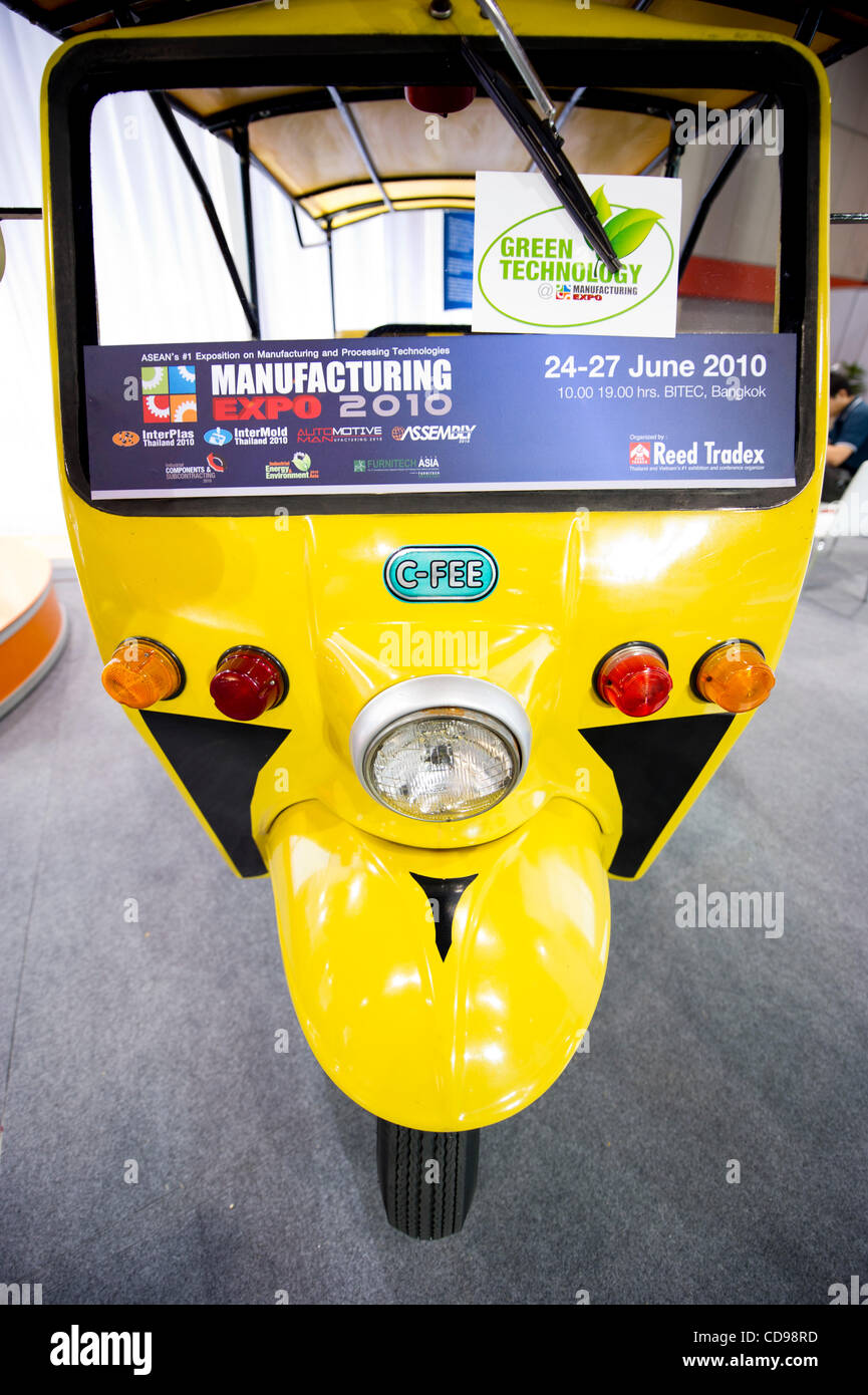 June 25, 2010 - Bangkok, Thailand - Thailand 1st solar powered auto rickshaw on display at Manufacturing Expo 2010. The solar powered auto rickshaw also known as three-wheeler or tuk-tuk was invented by Air Marshal Morakot Charnsomruad, chairman of Clean Fuel Energy Enterprise Co Ltd. The vehicle na Stock Photo