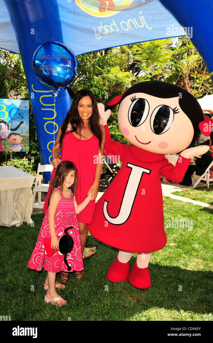 June 27, 2010 - Beverly Hills, California, U.S. - TIA CARRERE and daughter celebrate the launch of childrenÃ•s entertainment brand Juno Baby's ''One For All'' Bus Tour in Los Angeles (Credit Image: © Lisa Rose/ZUMApress.com) Stock Photo
