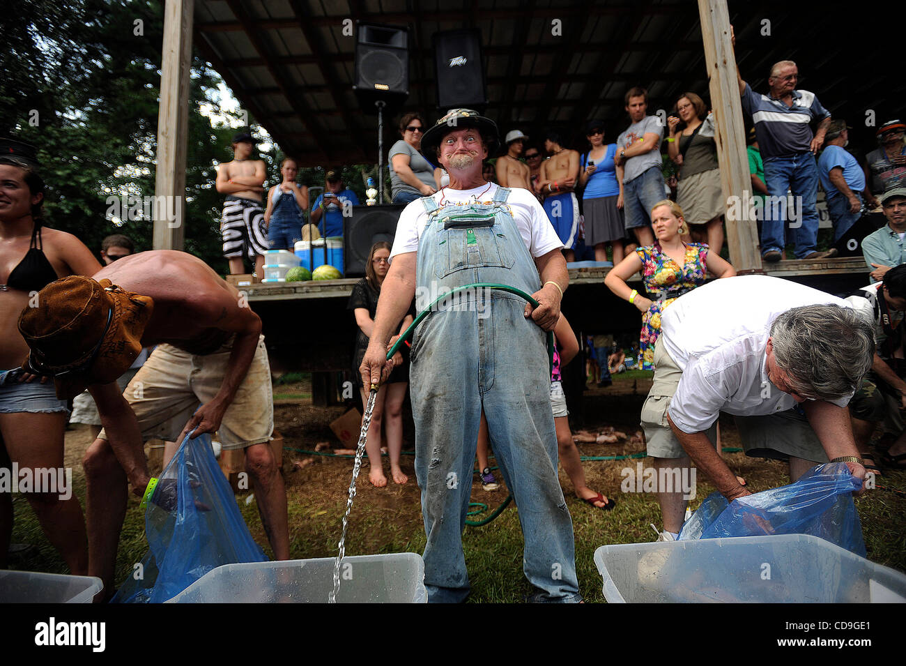 SATURDAY JULY 10, 2010 EAST DUBLIN, GEORGIA - A Redneck Games participant smiles goofily during the bobbing for pigs feet contest at Buckeye Park during the Redneck Games in East Dublin, Georgia. The games started in 1996 as spoof on the Olympics which were being held in Atlanta, Georgia at the time Stock Photo