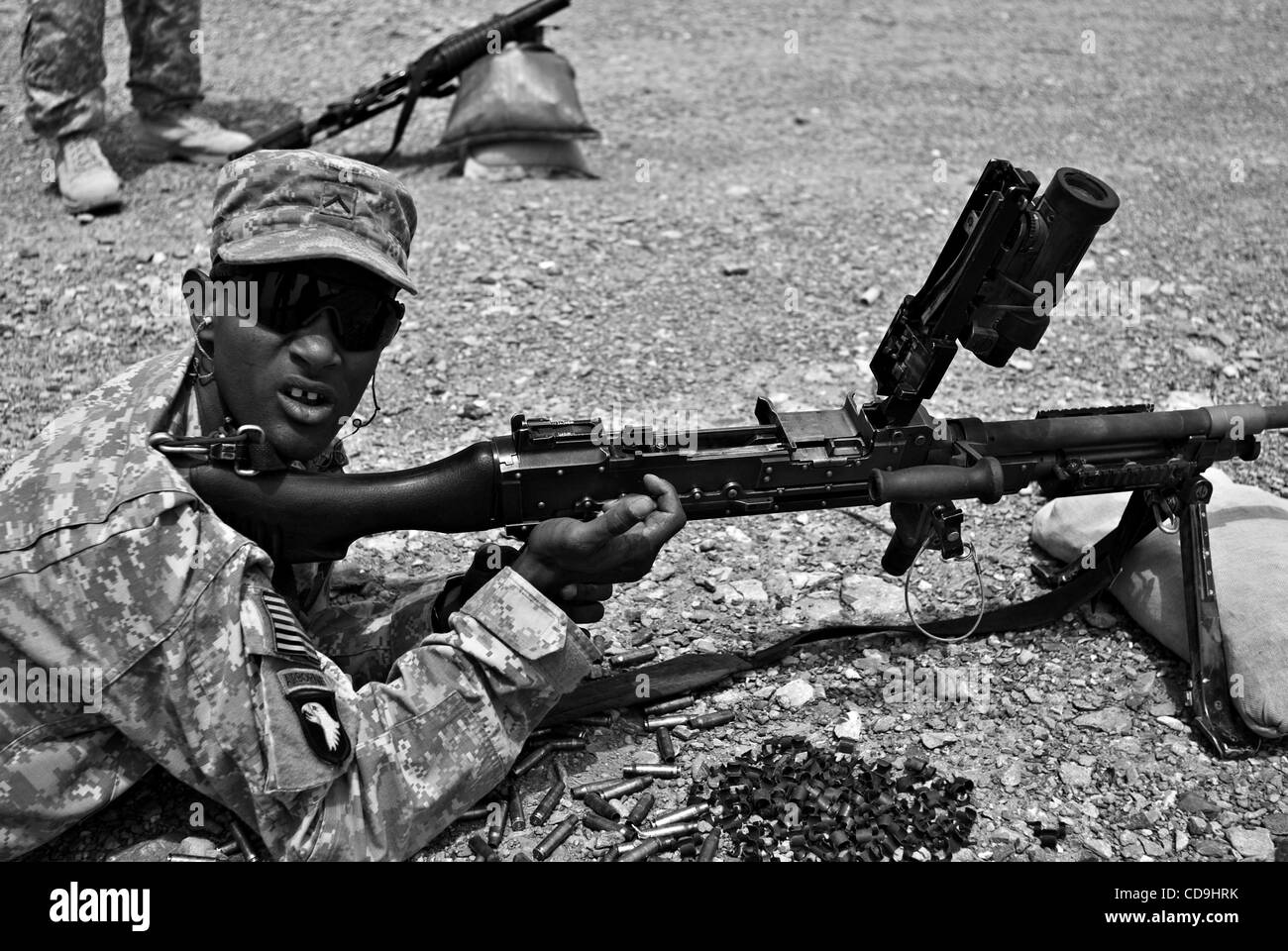 Pvt. MUSTAFA OMAR, an infantryman with Abu Company, 1st Battalion, 187th Infantry Regiment, looks at his squad leader while training on the M240B machine at the weapons range on Forward Operating Base Boris. Stock Photo
