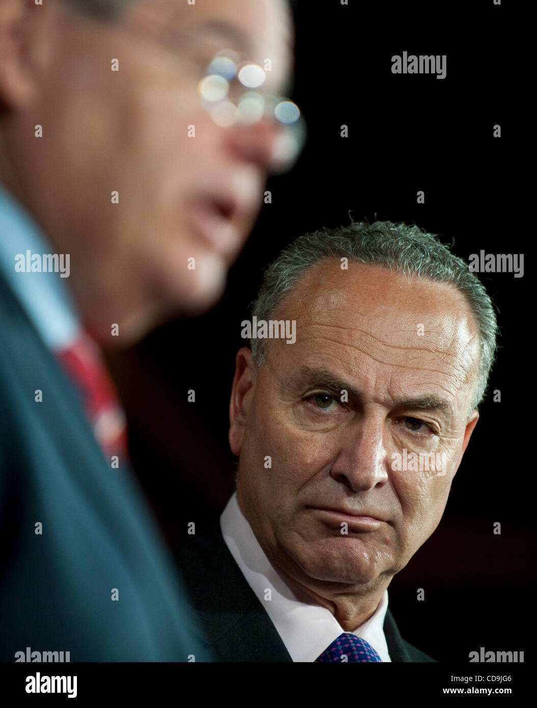 Jul 14, 2010 - Washington, District of Columbia, U.S., -  Senator Charles Schumer listens as Senator Bob Menendez speaks to the media, urging the British government to investigate whether BP a hand in securing the release of Lockerbie bomber al-Megrahi in order to help close a 00-million offshore oi Stock Photo