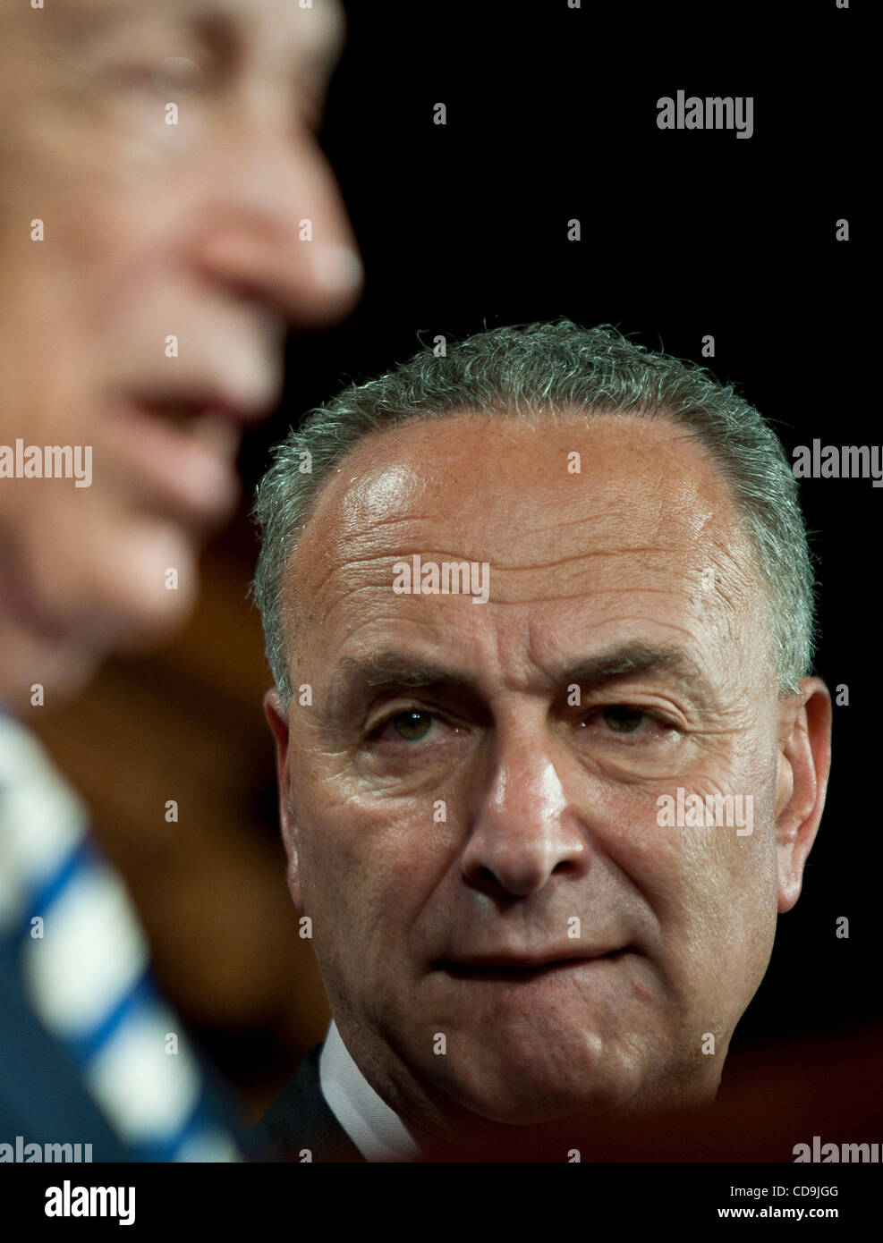 Jul 14, 2010 - Washington, District of Columbia, U.S., -  Senator Charles Schumer listens as Senator Bob Menendez speaks to the media, urging the British government to investigate whether BP a hand in securing the release of Lockerbie bomber al-Megrahi in order to help close a 00-million offshore oi Stock Photo