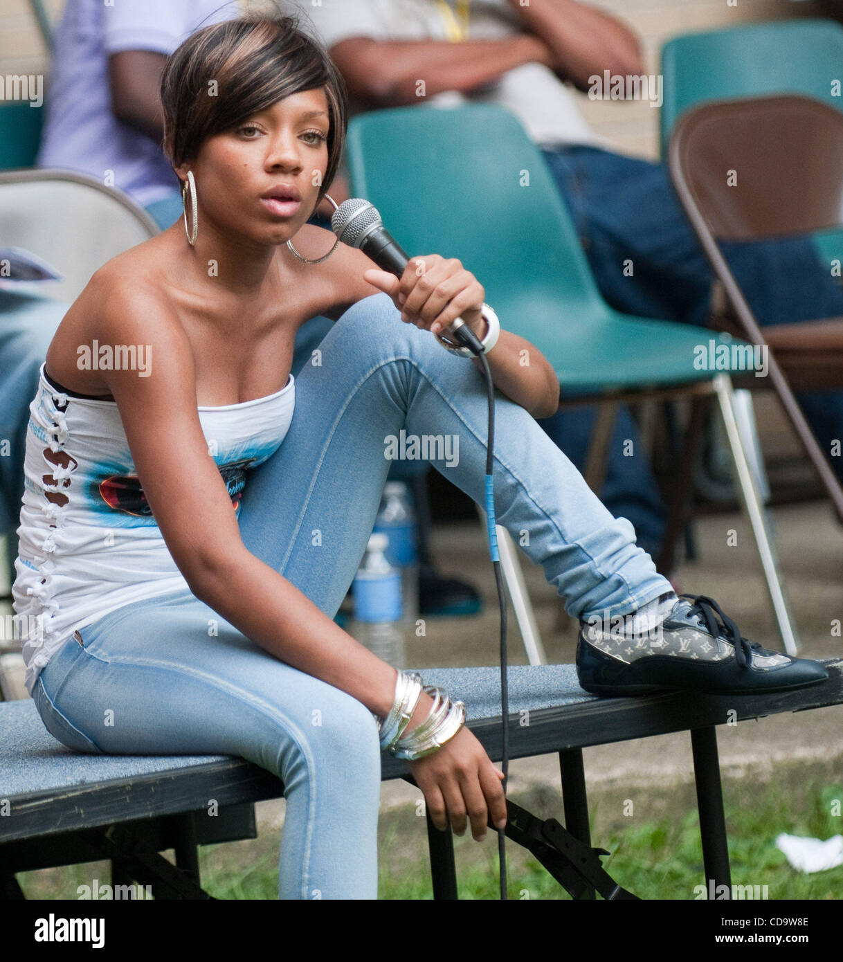 July 24, 2010 Philadelphia PA-USA- Actor/Rapper, and Judge on America’s Best Dance Crew” LIL MAMA, gives a speech to the youth at the youth Study/Detention center in Philadelphia as Charlie Mack, the sponsor of the event listens intently. The visit was a part of the 7th Annual Charlie Mack Party 4 P Stock Photo