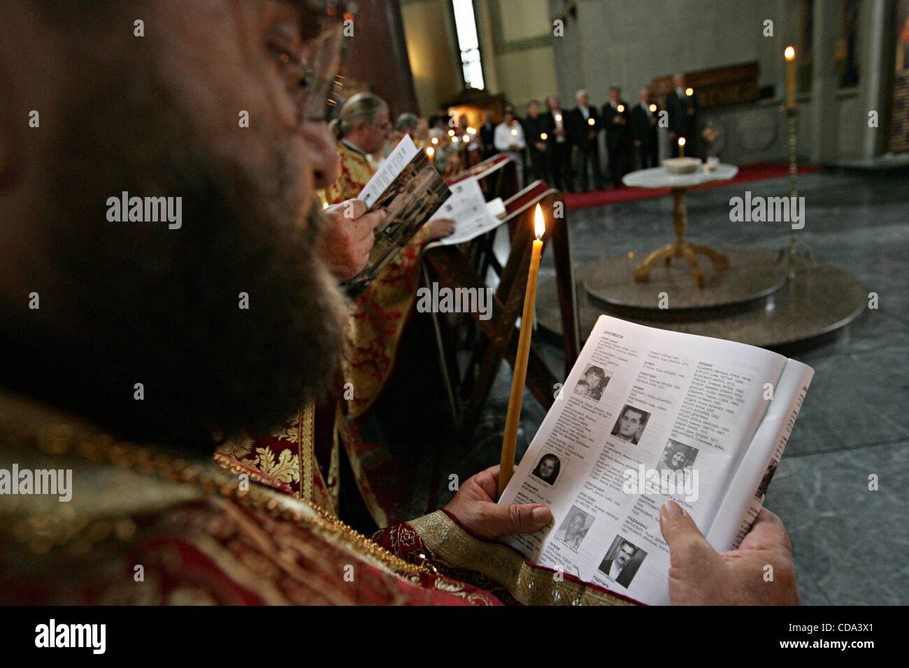 Aug 04, 2010 - Belgrade, Serbia - A priest is reading the names of the missing people during memorial service at the St. Marko church for the victims of the Croatia's military 'Operation Storm', marking the 15th anniversary. More than 200,000 Serbs fled the advancing Croatian troops in August 1995,  Stock Photo