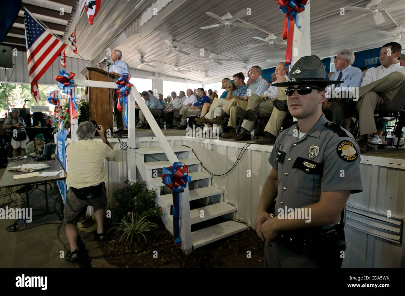 Aug 07, 2010 - Fancy Farm, Kentucky, U.S. - A Kentucky State Police trooper keeps watch as Democratic Governor STEVE BESHEAR speaks at the 130th annual Fancy Farm Picnic. Heckling from the audience, sometimes intense, is part of the event's tradition. (Credit Image: © Billy Suratt/Apex MediaWire/ZUM Stock Photo