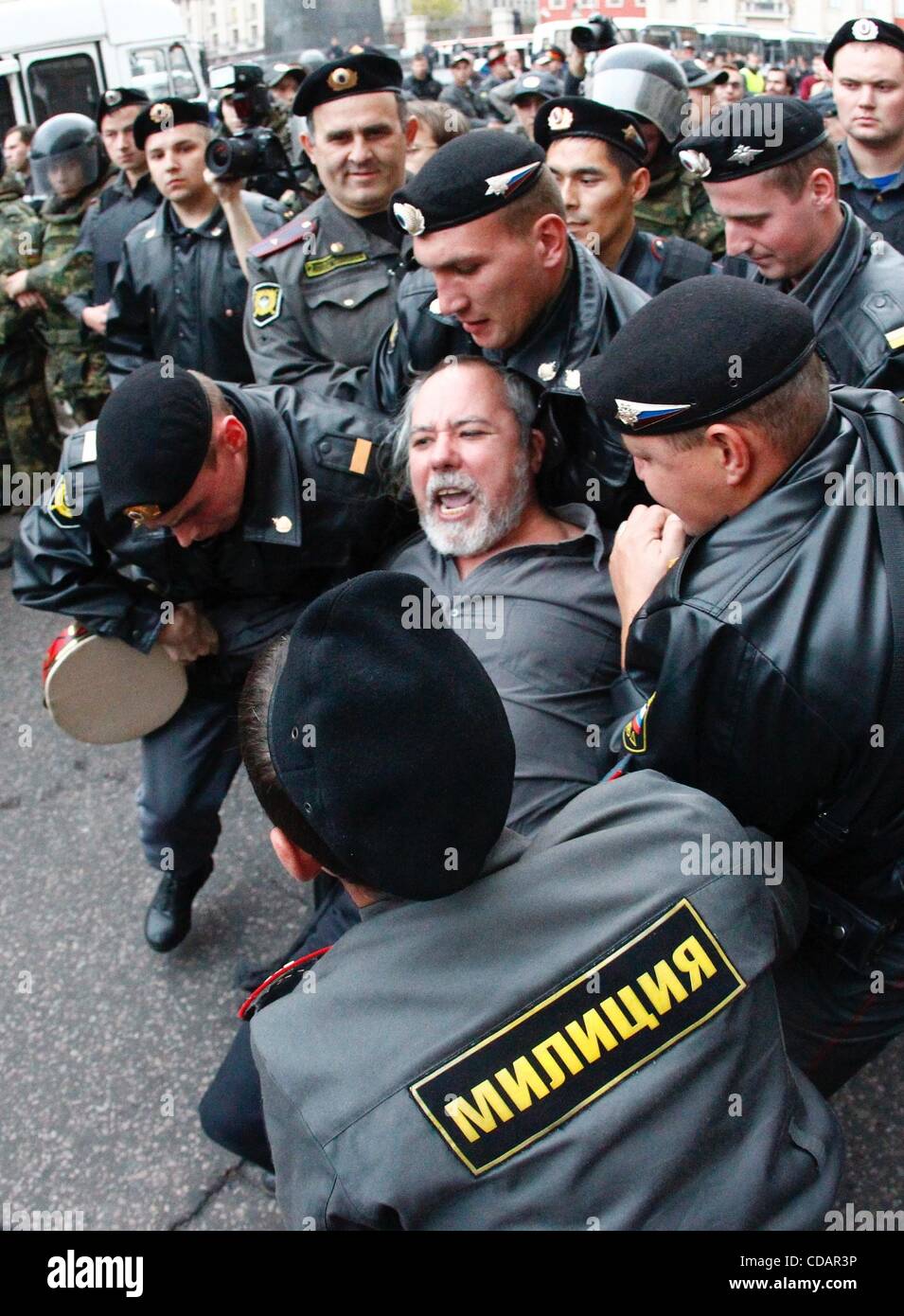 Sept 12, 2010 - Moscow, Russia - Thousands of Russians have rallied in what they are calling 'Day of Anger' protest against the government of Russian Prime Minister Putin, as part of opposition protests planned across the country. Police arresting protesters in front of the Moscow Mayor's head offic Stock Photo